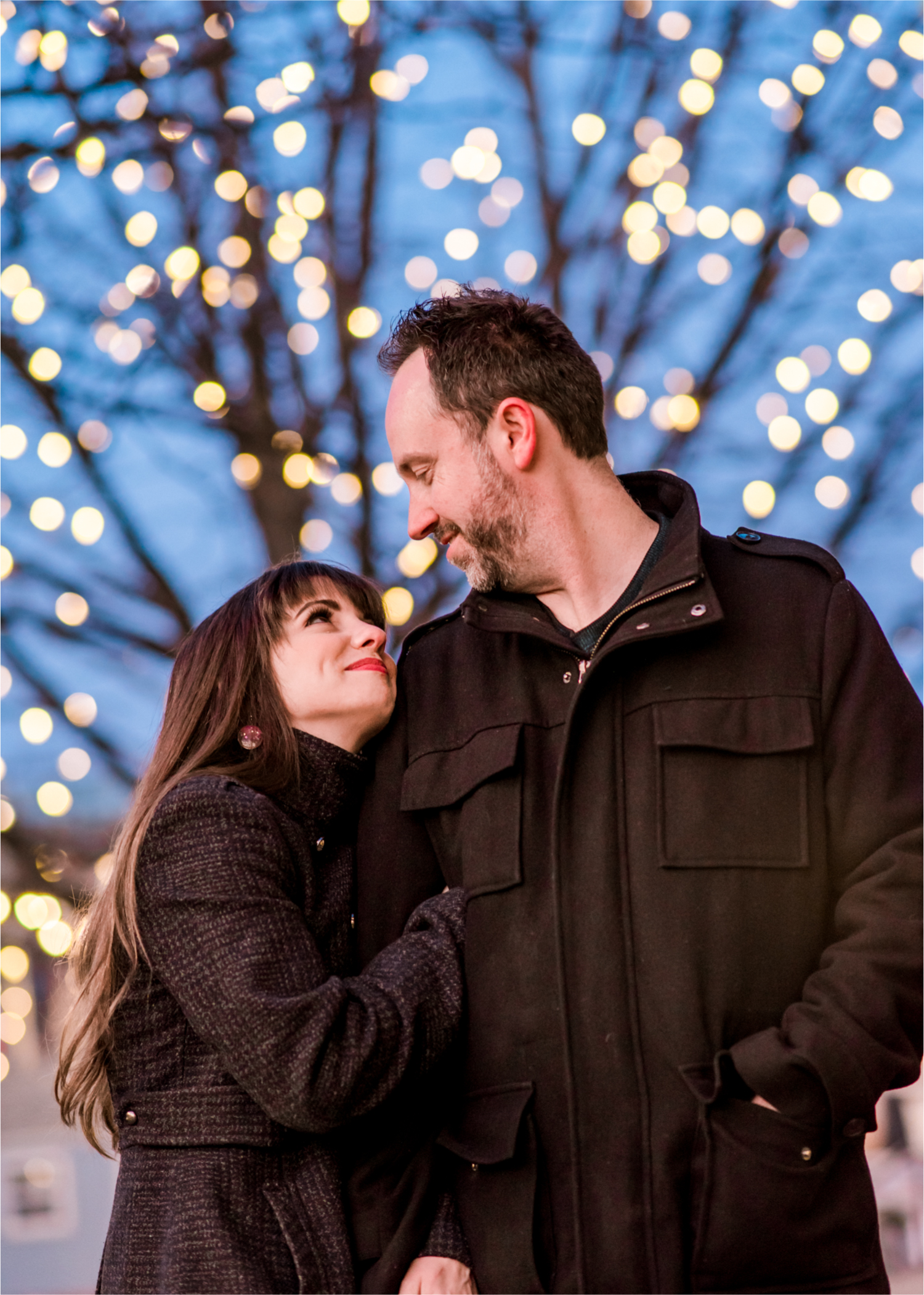 Snowy Winter Engagement in Old Town Fort Collins with twinkle lights | Britni Girard Photography, Colorado Wedding Photographer
