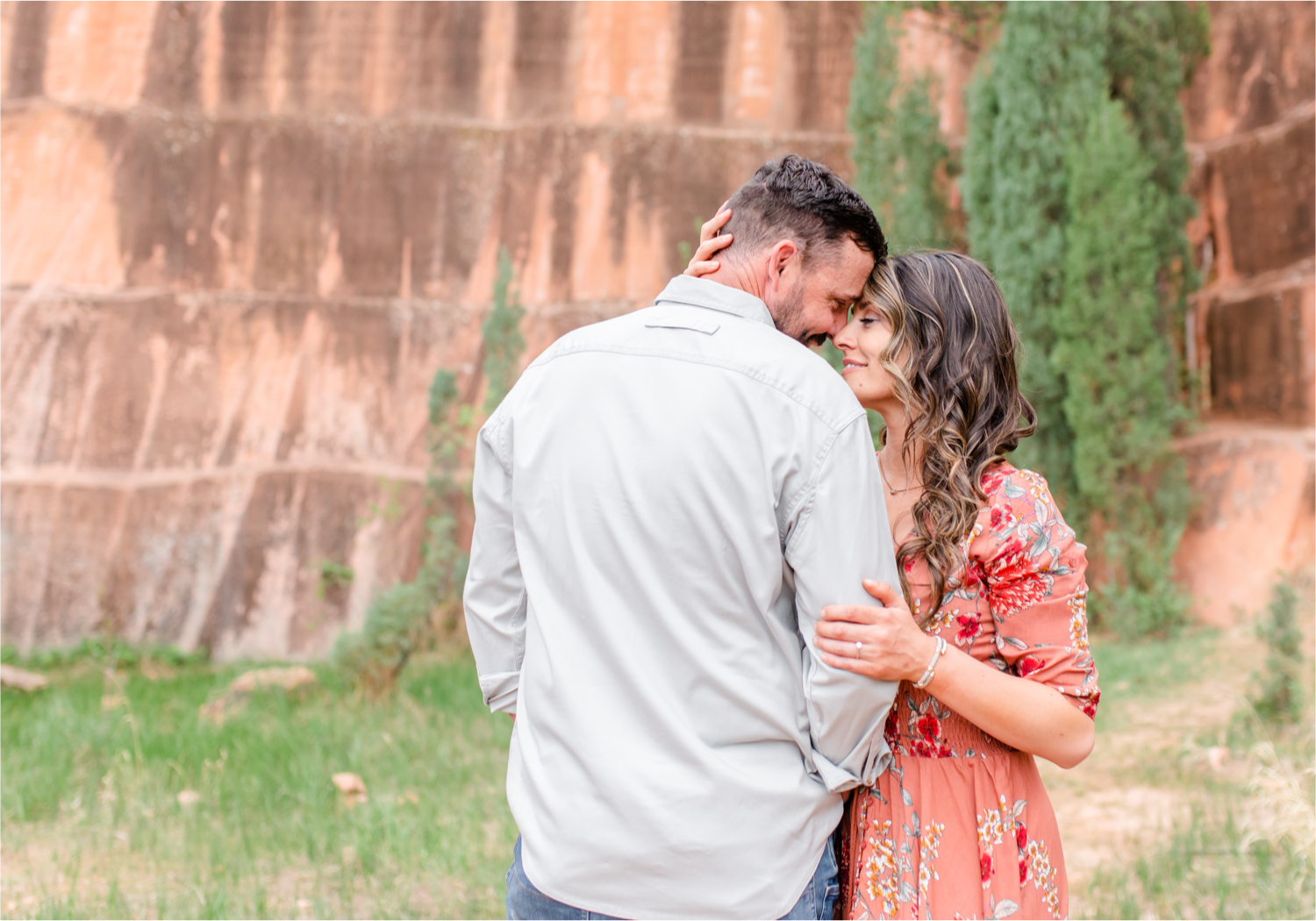 Romantic Summer Engagement at Red Rock Canyon Park in Colorado Springs | Britni Girard Photography Colorado Wedding Photographer and Videographer | Floral Dress, Green Dress, Grassy Fields, Rustic Boho Engagement