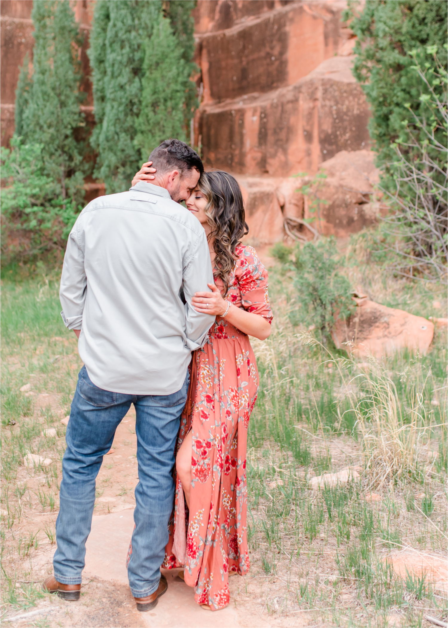Romantic Summer Engagement at Red Rock Canyon Park in Colorado Springs | Britni Girard Photography Colorado Wedding Photographer and Videographer | Floral Dress, Green Dress, Grassy Fields, Rustic Boho Engagement