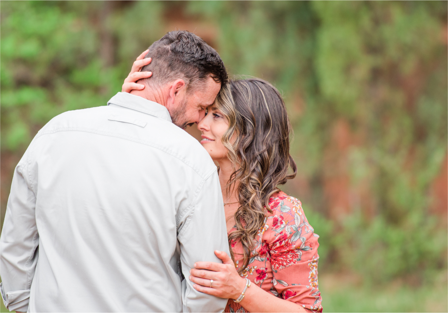 Romantic Summer Engagement at Red Rock Canyon Park in Colorado Springs | Britni Girard Photography Colorado Wedding Photographer and Videographer | Floral Dress, Green Dress, Grassy Fields, Rustic Boho Engagement
