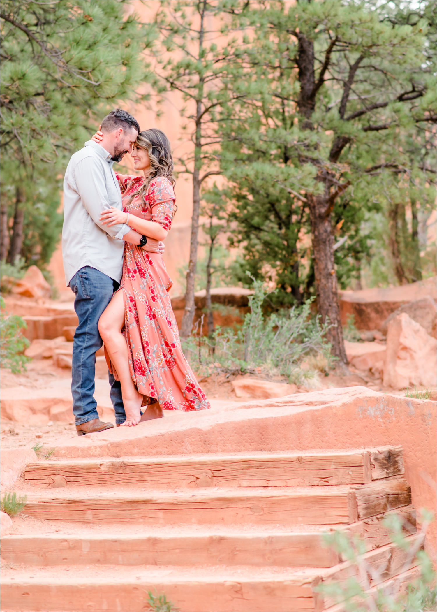 Romantic Summer Engagement at Red Rock Canyon Park in Colorado Springs | Britni Girard Photography Colorado Wedding Photographer and Videographer | Floral Dress, Green Dress, Grassy Fields, Rustic Boho Engagement