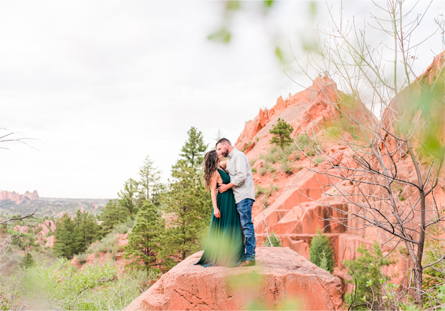 Romantic Summer Engagement at Red Rock Canyon Park in Colorado Springs | Britni Girard Photography Colorado Wedding Photographer and Videographer | Floral Dress, Green Dress, Grassy Fields, Rustic Boho Engagement