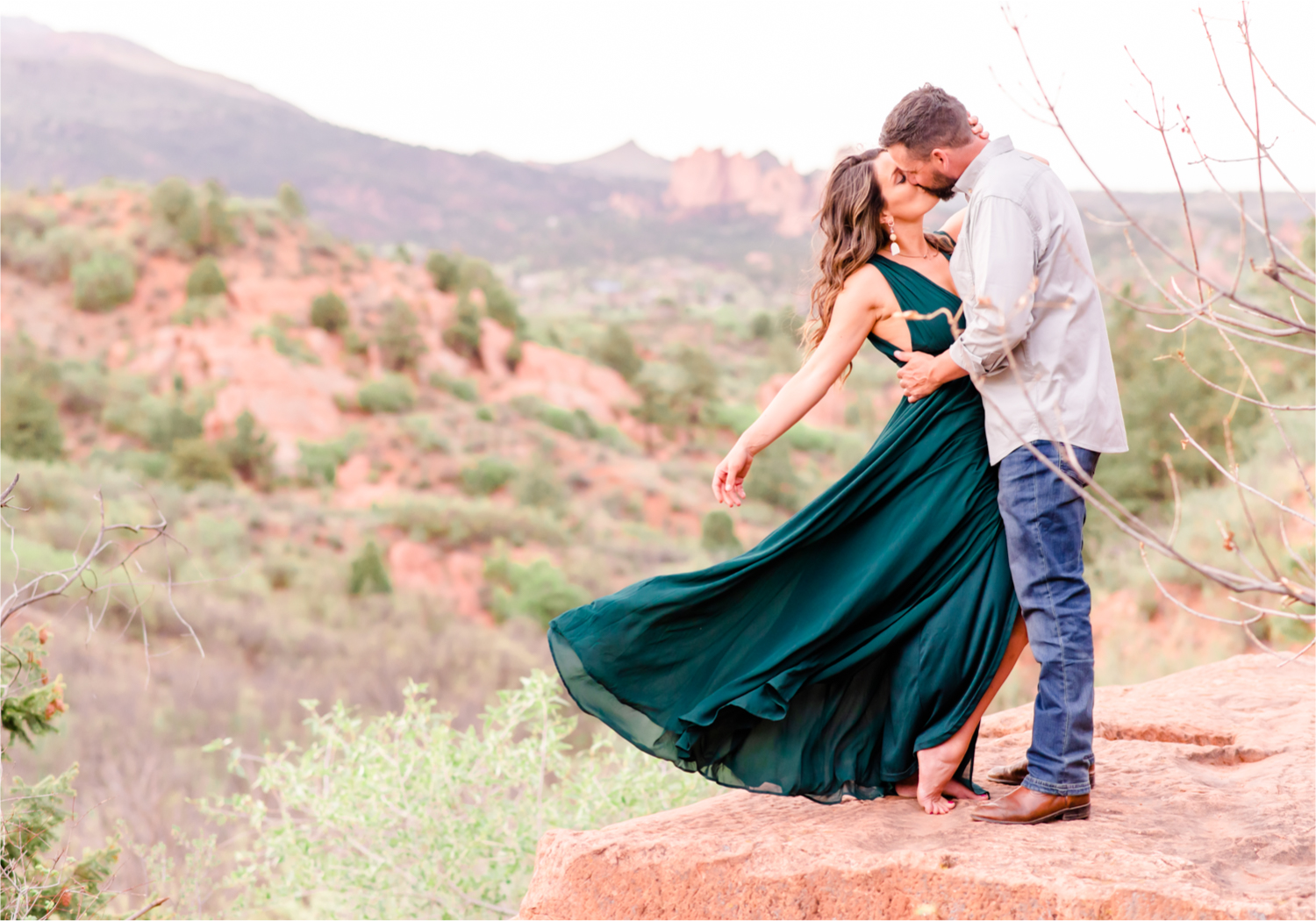 Romantic Summer Engagement at Red Rock Canyon Park in Colorado Springs | Britni Girard Photography Colorado Wedding Photographer and Videographer | Floral Dress, Green Dress, Grassy Fields, Rustic Boho Engagement