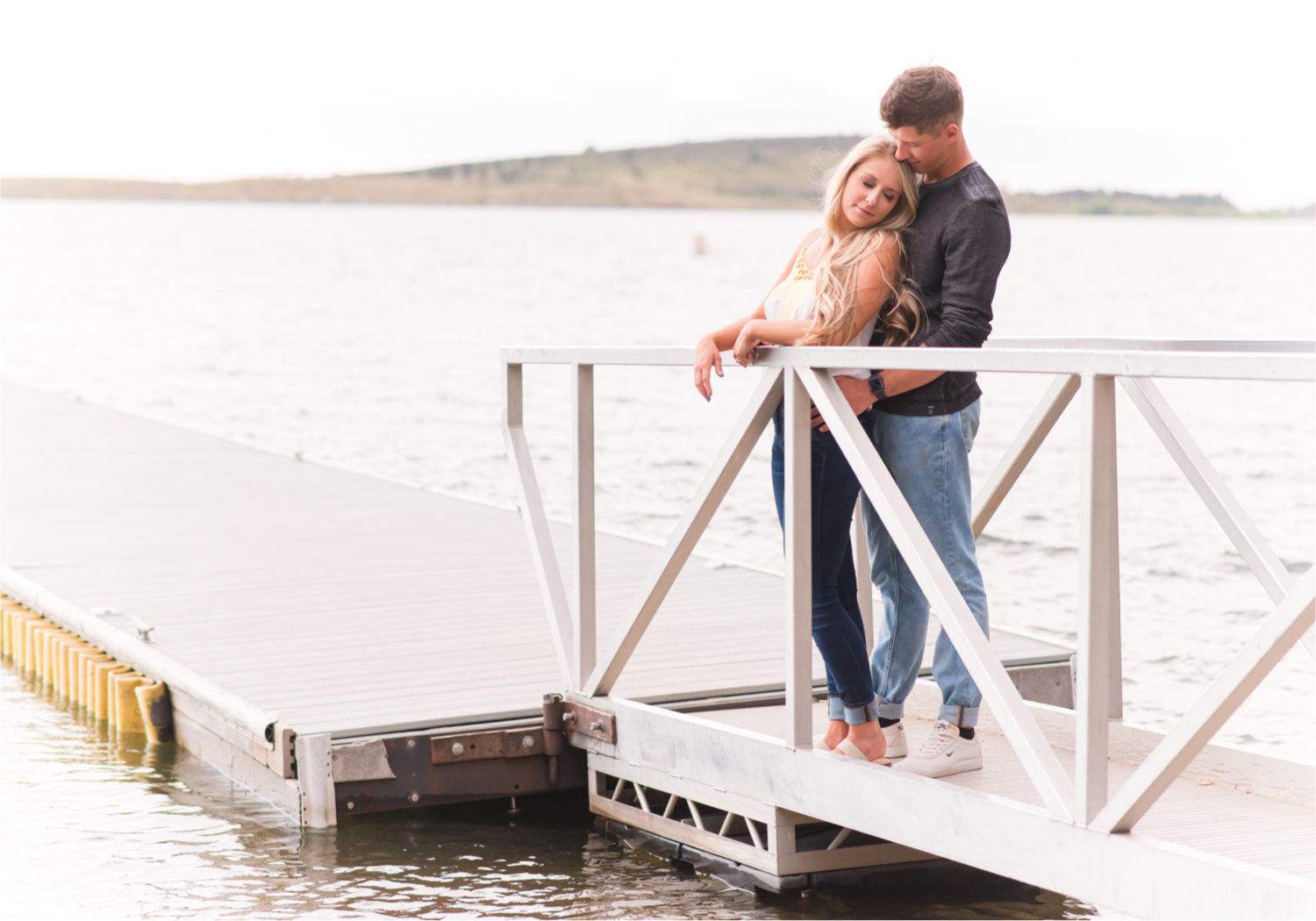 Romantic Summer engagement Lakeside at Carter Lake | Britni Girard Photography, Colorado Wedding Photographer | Walks down by the water and dancing on the dock during casual engagement in Loveland Colorado