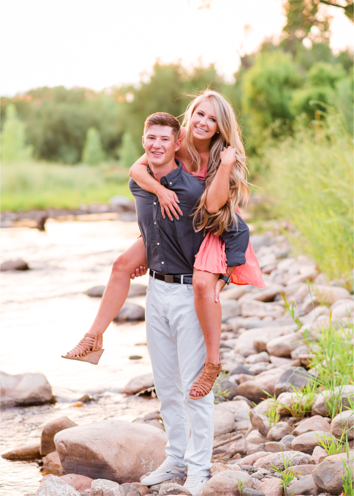 Romantic Winery engagement at Sweet Heart Winery in Loveland  | Britni Girard Photography, Colorado Wedding Photographer | Strolls along the Big Thompson River at Sunset, toasting their engagement with Sweet Heart Wine and dancing in the field during sunset