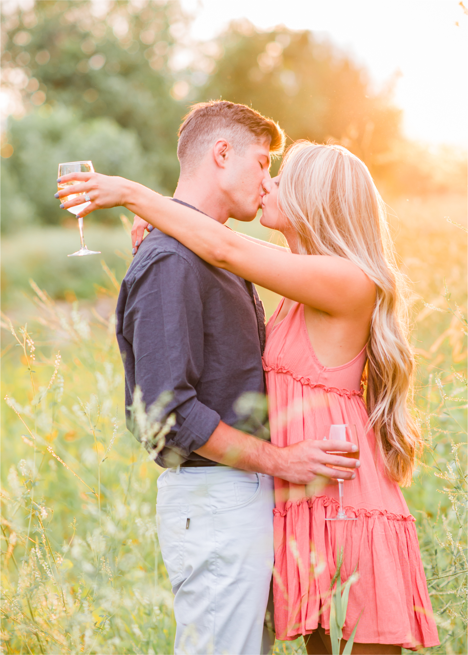 Romantic Winery engagement at Sweet Heart Winery in Loveland  | Britni Girard Photography, Colorado Wedding Photographer | Strolls along the Big Thompson River at Sunset, toasting their engagement with Sweet Heart Wine and dancing in the field during sunset