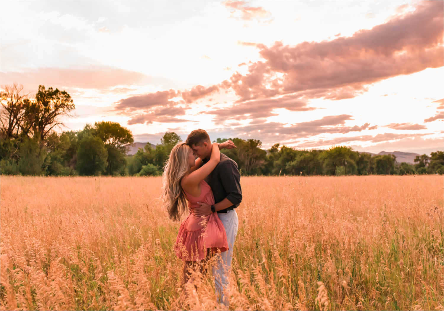 Romantic Winery engagement at Sweet Heart Winery in Loveland  | Britni Girard Photography, Colorado Wedding Photographer | Strolls along the Big Thompson River at Sunset, toasting their engagement with Sweet Heart Wine and dancing in the field during sunset