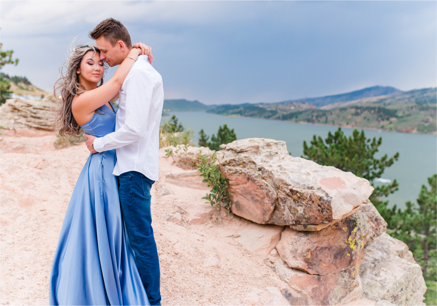 Romantic and Playful Summer engagement session at Horsetooth Reservoir in Fort Collins Colorado | Britni Girard Photographer | Wedding photographer and videographer team | Stormy and Windy Engagement on the cliffs of Horsetooth | Rotary Park