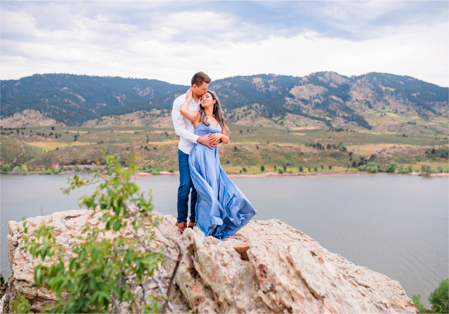 Romantic and Playful Summer engagement session at Horsetooth Reservoir in Fort Collins Colorado | Britni Girard Photographer | Wedding photographer and videographer team | Stormy and Windy Engagement on the cliffs of Horsetooth | Rotary Park
