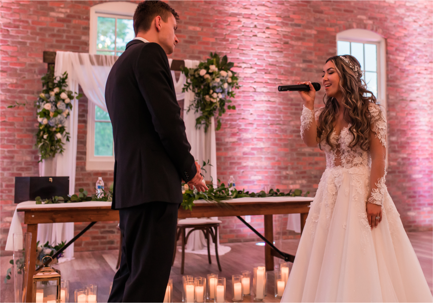 Romantic and Rustic Wedding at The Mill in Windsor | Britni Girard Photography | Colorado based wedding photography and videography team | Bride serenades groom at reception
