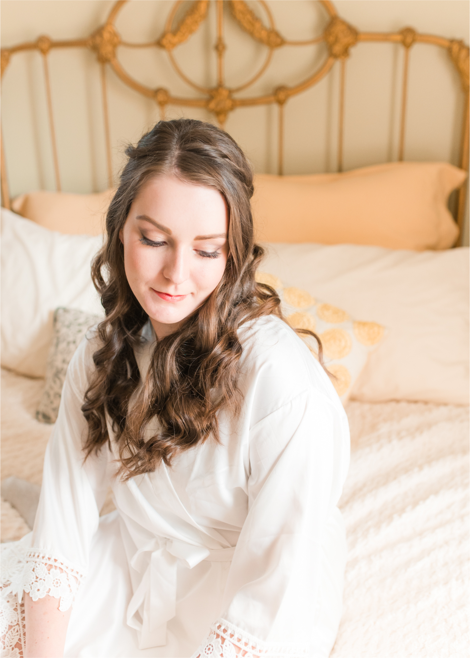 Summer Ellis Ranch Wedding in Loveland Colorado | Britni Girard Photography | Wedding Photo and Video Team | Bride hair Dondi AtWow from Sola Salon in Loveland | Getting Ready at Air BnB | Bride in robe on bed