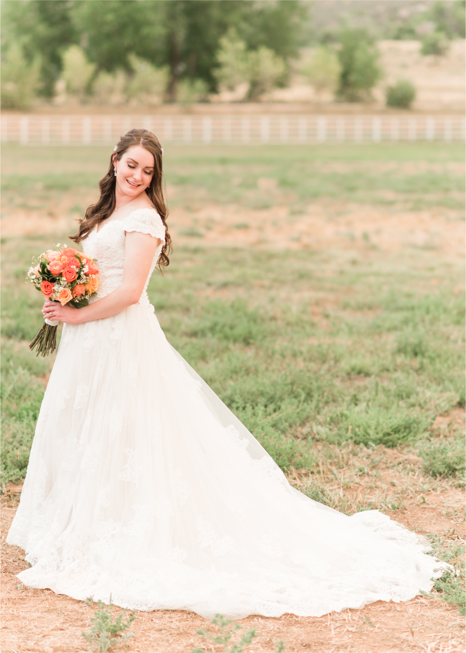 Summer Ellis Ranch Wedding in Loveland Colorado | Britni Girard Photography | Wedding Photo and Video Team | Bride hair Dondi AtWow from Sola Salon in Loveland | Floral hair crystals | Bridal Portraits | Orange Bouquet | Country Field Bride