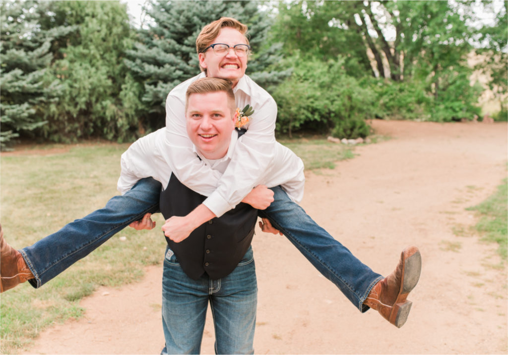 Summer Ellis Ranch Wedding in Loveland Colorado | Britni Girard Photography | Wedding Photo and Video Team | silly groomsmen photo