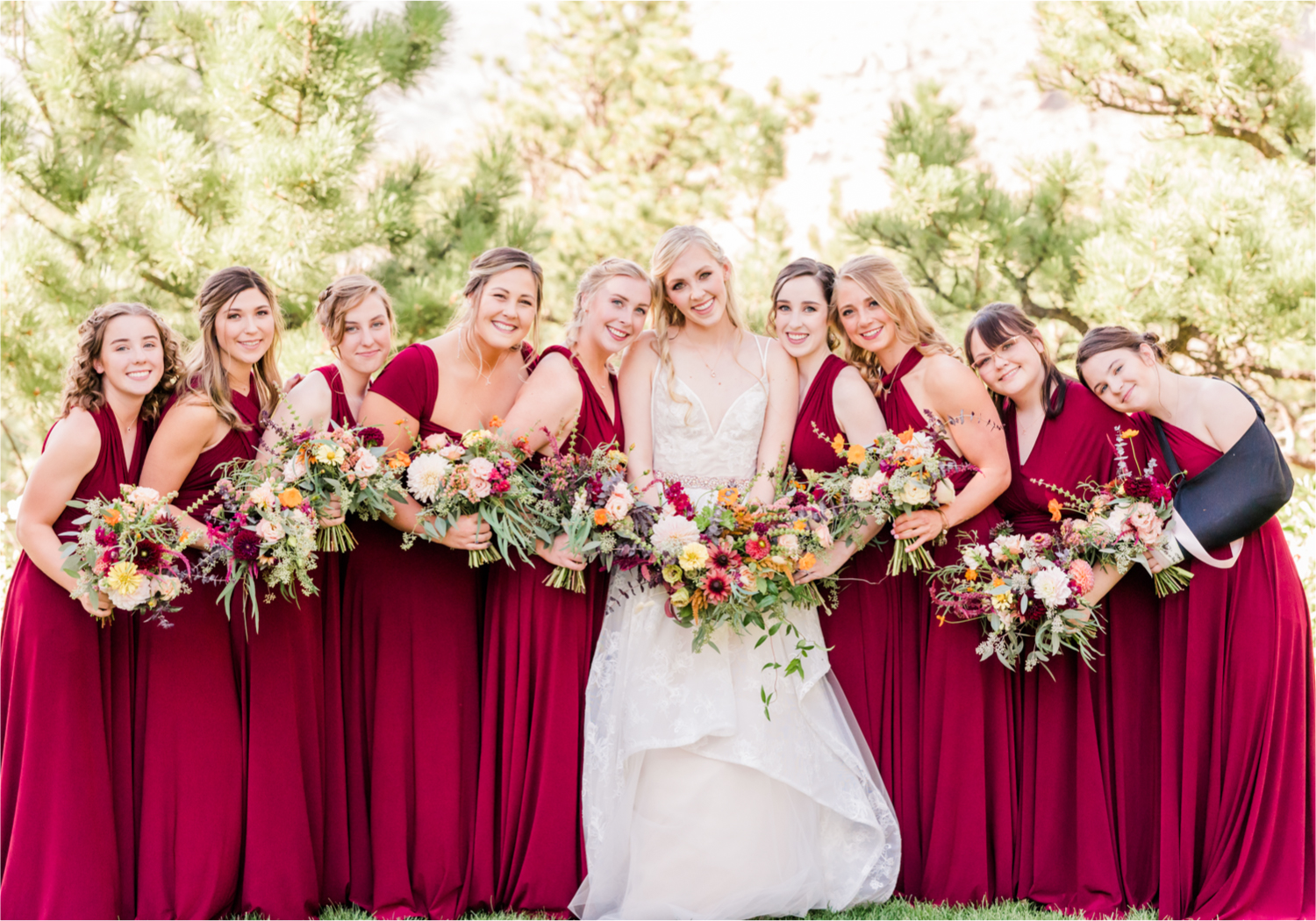Romantic Whimsical Wedding at the Lionscrest Manor in Lyons, CO | Britni Girard Photography - Wedding Photo and Video Team | Rustic Fall Decor mixed in Burgundy, Blush, Gold and Sage | Wedding Dress from Anna Be Bridal by Hailey Paige | Hair and Makeup by Glam 5280 Chaundra Revier | Bride and Bridesmaids | Florals by Aflorae