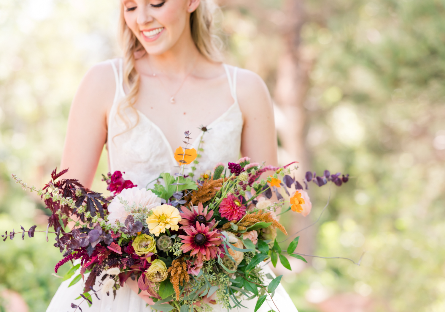 Romantic Whimsical Wedding at the Lionscrest Manor in Lyons, CO | Britni Girard Photography - Wedding Photo and Video Team | Rustic Fall Decor mixed in Burgundy, Blush, Gold and Sage | Wedding Dress from Anna Be Bridal by Hailey Paige | Hair and Makeup by Glam 5280 Chaundra Revier | Florals by Aflorae