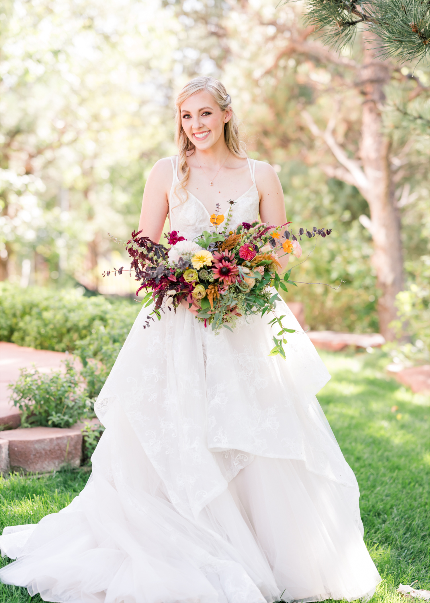 Romantic Whimsical Wedding at the Lionscrest Manor in Lyons, CO | Britni Girard Photography - Wedding Photo and Video Team | Rustic Fall Decor mixed in Burgundy, Blush, Gold and Sage | Wedding Dress from Anna Be Bridal by Hailey Paige | Hair and Makeup by Glam 5280 Chaundra Revier | Florals by Aflorae
