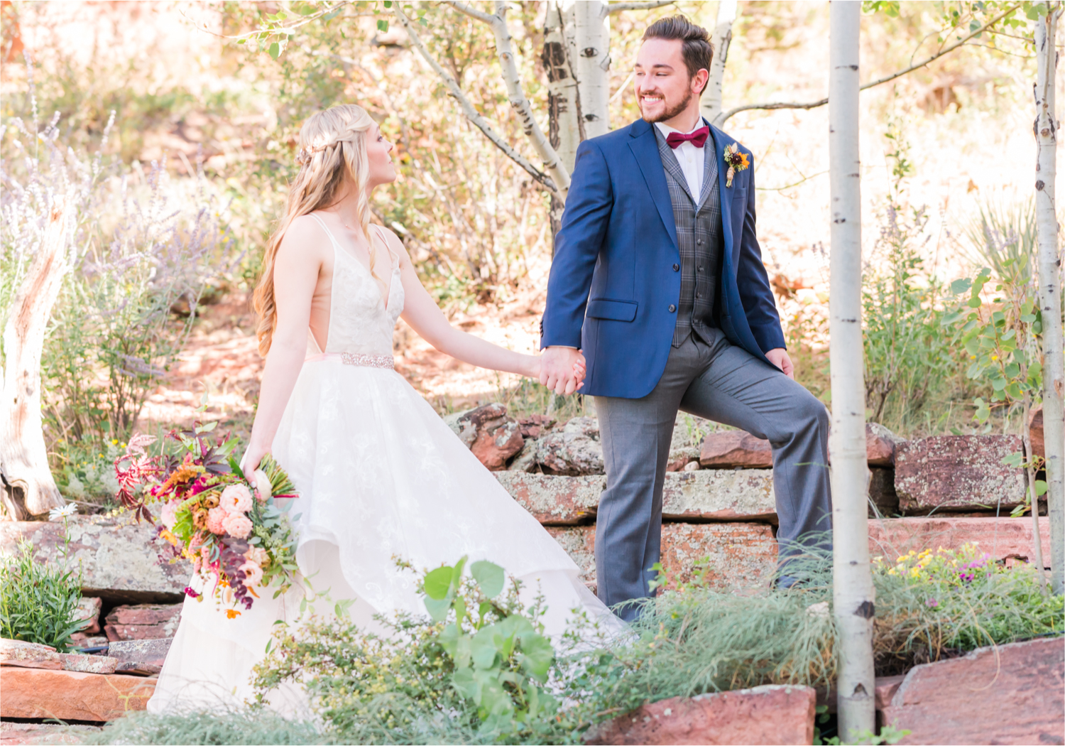 Romantic Whimsical Wedding at the Lionscrest Manor in Lyons, CO | Britni Girard Photography - Wedding Photo and Video Team | Rustic Fall Decor mixed in Burgundy, Blush, Gold and Sage | Groom in Custom Suit from Jos. a Banks | Romantic Bride and Groom Portraits in the rocky mountains | Wedding Dress from Anna Be Bridal by Hailey Paige | Hair and Makeup by Glam 5280 Chaundra Revier | Florals by Aflorae