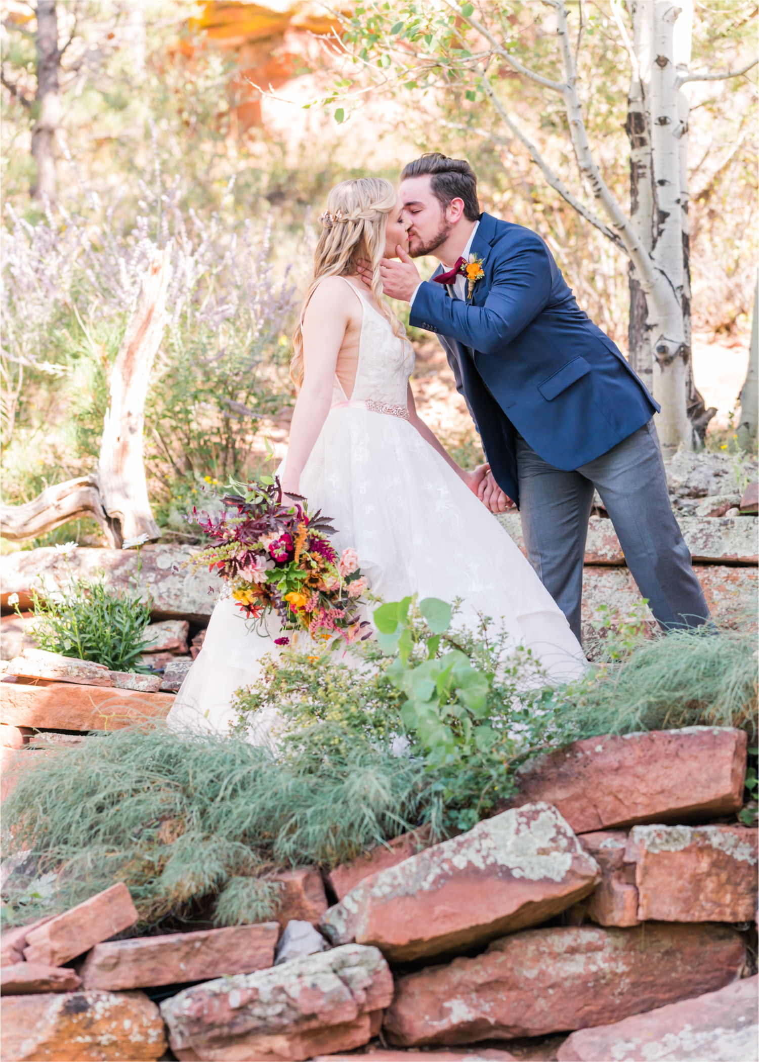 Romantic Whimsical Wedding at the Lionscrest Manor in Lyons, CO | Britni Girard Photography - Wedding Photo and Video Team | Rustic Fall Decor mixed in Burgundy, Blush, Gold and Sage | Groom in Custom Suit from Jos. a Banks | Romantic Bride and Groom Portraits in the rocky mountains | Wedding Dress from Anna Be Bridal by Hailey Paige | Hair and Makeup by Glam 5280 Chaundra Revier | Florals by Aflorae