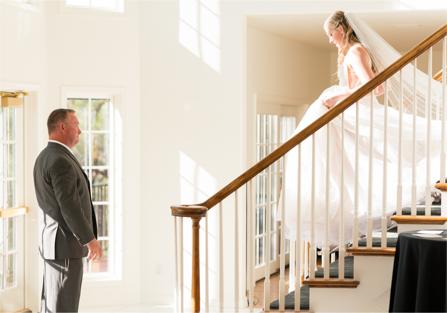 Romantic Whimsical Wedding at the Lionscrest Manor in Lyons, CO | Britni Girard Photography - Wedding Photo and Video Team | Rustic Fall Decor mixed in Burgundy, Blush, Gold and Sage | Wedding Dress from Anna Be Bridal by Hailey Paige | Hair and Makeup by Glam 5280 Chaundra Revier | Florals by Aflorae | Bride coming down stairs before ceremony