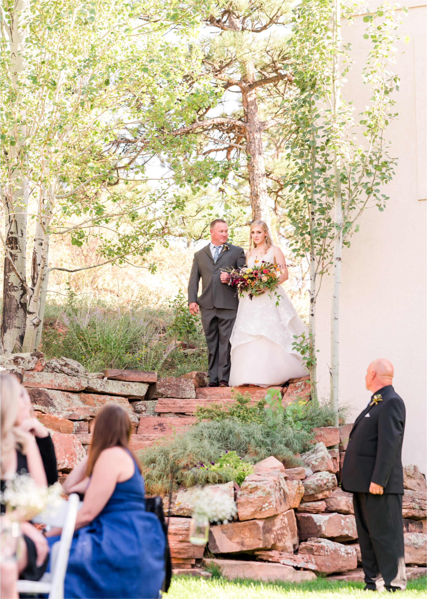 Romantic Whimsical Wedding at the Lionscrest Manor in Lyons, CO | Britni Girard Photography - Wedding Photo and Video Team | Rustic Fall Decor mixed in Burgundy, Blush, Gold and Sage | Wedding Dress from Anna Be Bridal by Hailey Paige | Hair and Makeup by Glam 5280 Chaundra Revier | Florals by Aflorae | Ceremony Site overlooking the Rocky Mountains | Mountaintop Ceremony | Bride Entrance