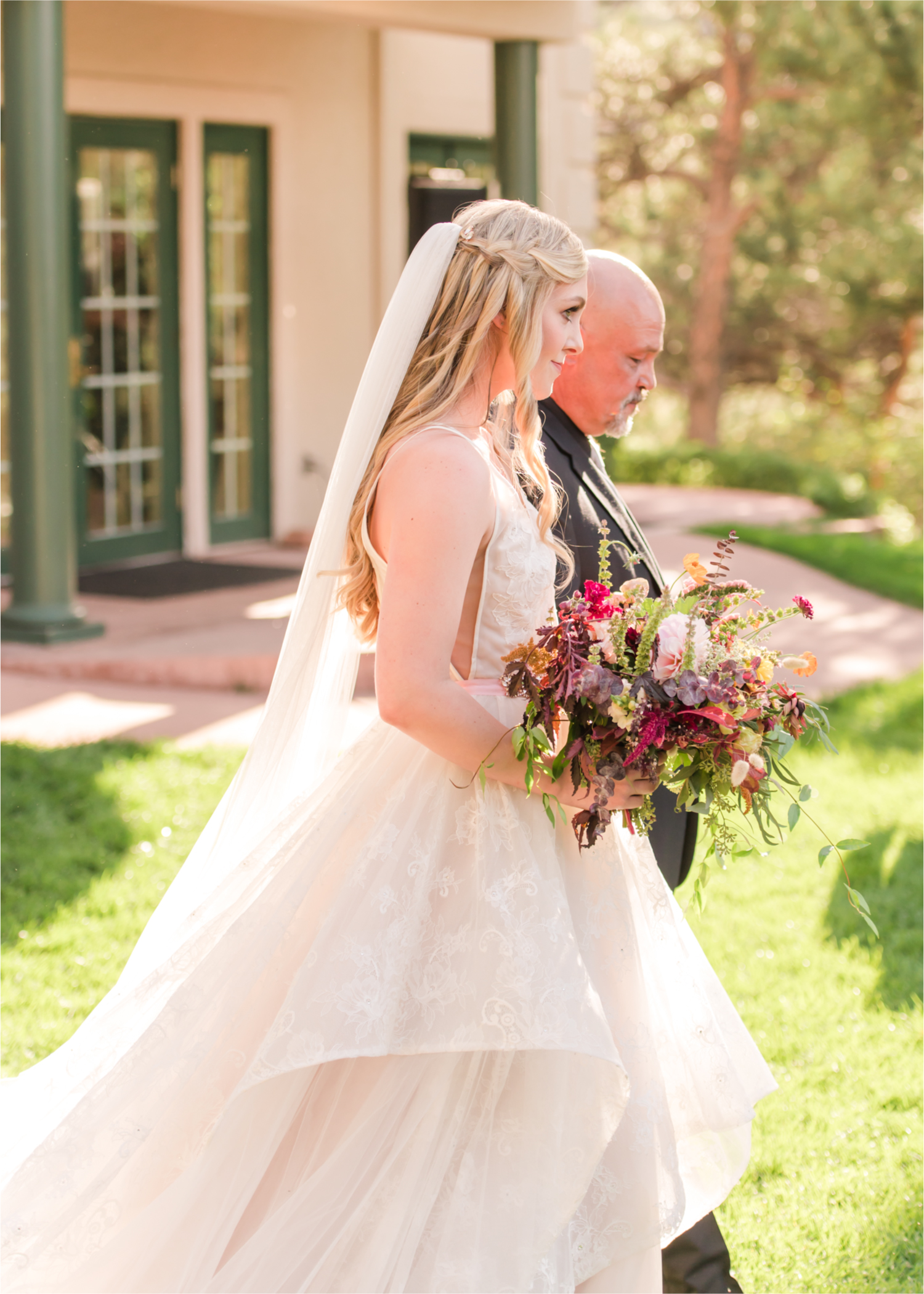 Romantic Whimsical Wedding at the Lionscrest Manor in Lyons, CO | Britni Girard Photography - Wedding Photo and Video Team | Rustic Fall Decor mixed in Burgundy, Blush, Gold and Sage | Wedding Dress from Anna Be Bridal by Hailey Paige | Hair and Makeup by Glam 5280 Chaundra Revier | Florals by Aflorae | Ceremony Site overlooking the Rocky Mountains | Mountaintop Ceremony | Bride Entrance