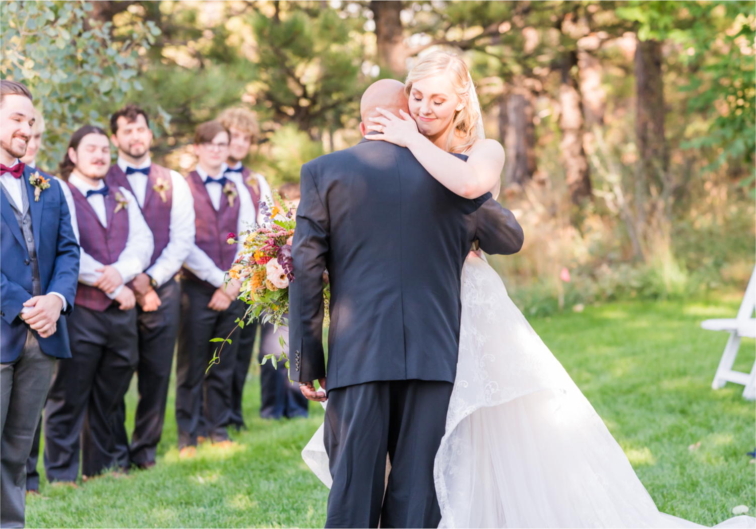 Romantic Whimsical Wedding at the Lionscrest Manor in Lyons, CO | Britni Girard Photography - Wedding Photo and Video Team | Rustic Fall Decor mixed in Burgundy, Blush, Gold and Sage | Wedding Dress from Anna Be Bridal by Hailey Paige | Hair and Makeup by Glam 5280 Chaundra Revier | Florals by Aflorae | Ceremony Site overlooking the Rocky Mountains | Mountaintop Ceremony | Bride Entrance
