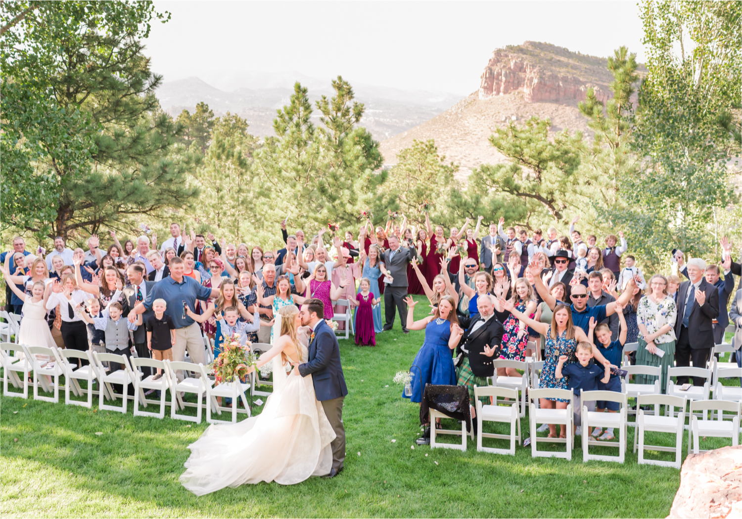 Romantic Whimsical Wedding at the Lionscrest Manor in Lyons, CO | Britni Girard Photography - Wedding Photo and Video Team | Rustic Fall Decor mixed in Burgundy, Blush, Gold and Sage | Wedding Dress from Anna Be Bridal by Hailey Paige | Hair and Makeup by Glam 5280 Chaundra Revier | Florals by Aflorae | Ceremony Site overlooking the Rocky Mountains | Mountaintop Ceremony before Sunset | End of Aisle Group Photo