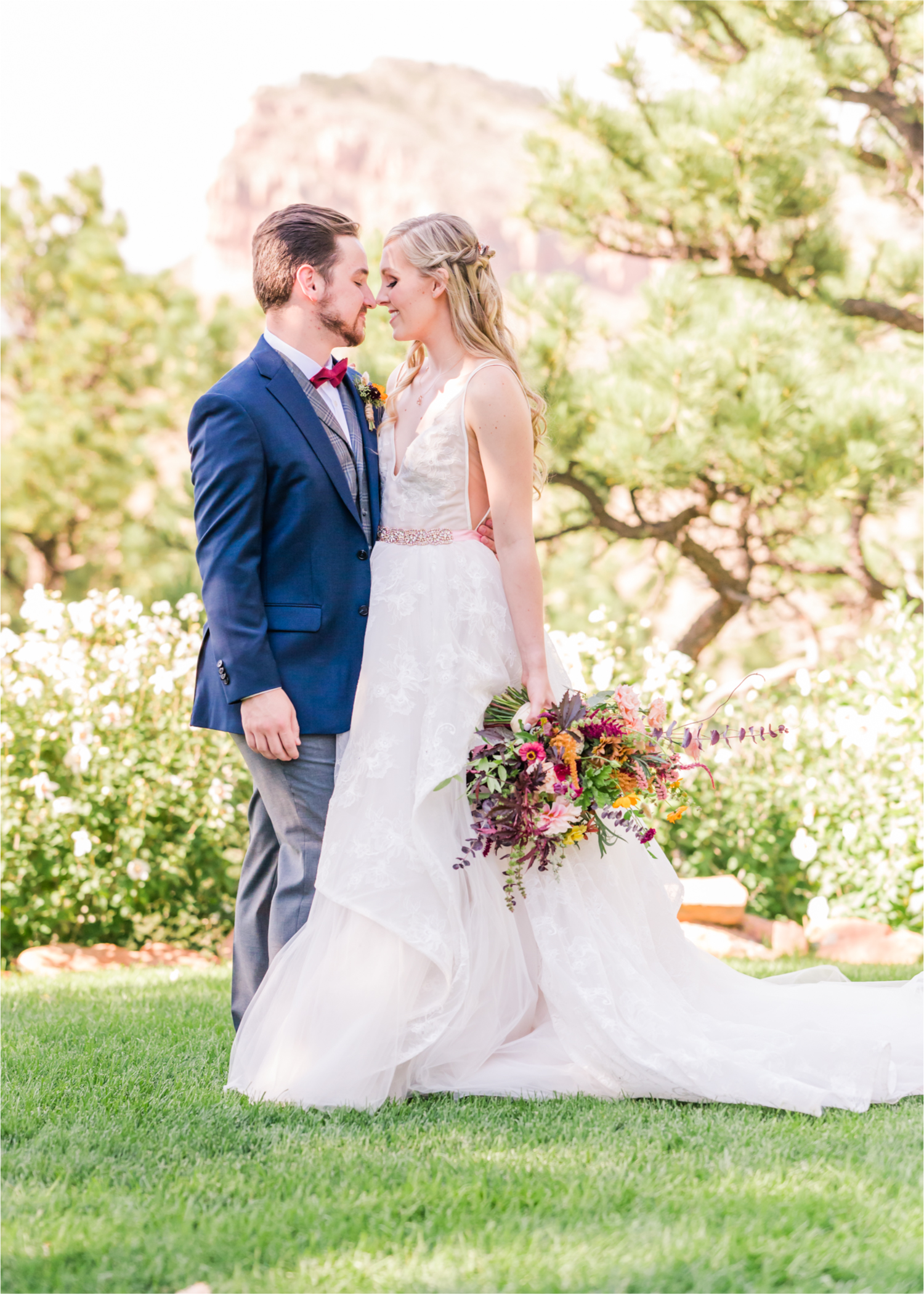 Romantic Whimsical Wedding at the Lionscrest Manor in Lyons, CO | Britni Girard Photography - Wedding Photo and Video Team | Rustic Fall Decor mixed in Burgundy, Blush, Gold and Sage | Groom in Custom Suit from Jos. a Banks | Romantic Bride and Groom Portraits in the rocky mountains | Wedding Dress from Anna Be Bridal by Hailey Paige | Hair and Makeup by Glam 5280 Chaundra Revier | Florals by Aflorae