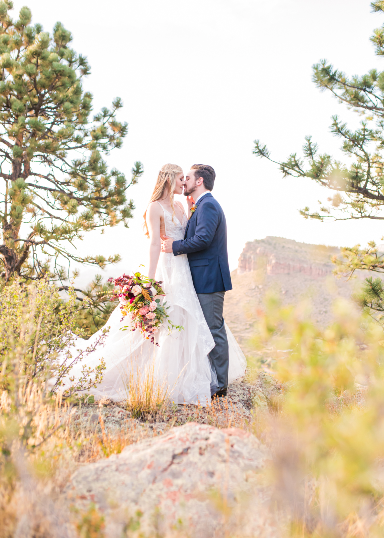 Romantic Whimsical Wedding at the Lionscrest Manor in Lyons, CO | Britni Girard Photography - Wedding Photo and Video Team | Rustic Fall Decor mixed in Burgundy, Blush, Gold and Sage | Groom in Custom Suit from Jos. a Banks | Romantic Bride and Groom Portraits in the rocky mountains | Wedding Dress from Anna Be Bridal by Hailey Paige | Hair and Makeup by Glam 5280 Chaundra Revier | Florals by Aflorae | Fine Art Wedding Photography