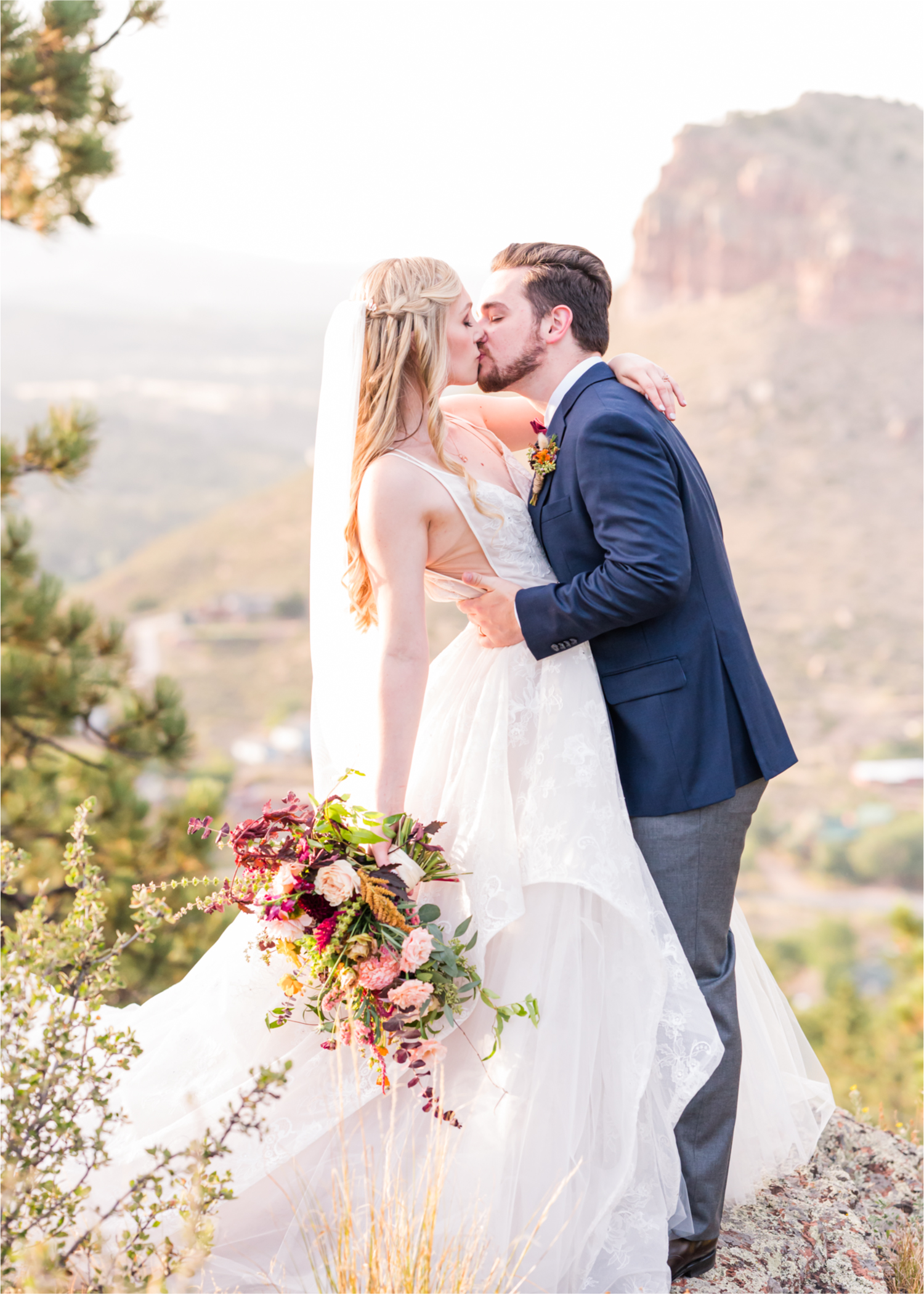 Romantic Whimsical Wedding at the Lionscrest Manor in Lyons, CO | Britni Girard Photography - Wedding Photo and Video Team | Rustic Fall Decor mixed in Burgundy, Blush, Gold and Sage | Groom in Custom Suit from Jos. a Banks | Romantic Bride and Groom Portraits in the rocky mountains | Wedding Dress from Anna Be Bridal by Hailey Paige | Hair and Makeup by Glam 5280 Chaundra Revier | Florals by Aflorae | Fine Art Wedding Photography