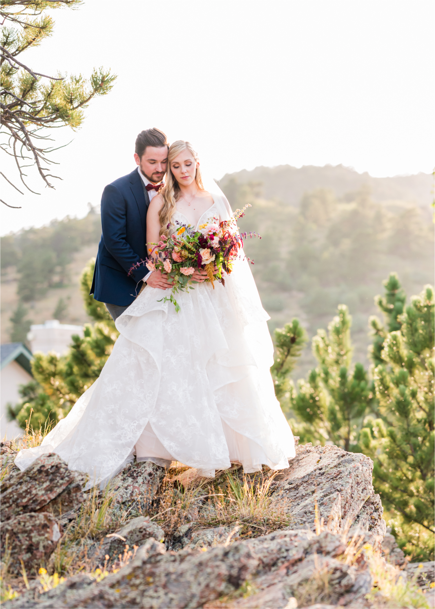 Romantic Whimsical Wedding at the Lionscrest Manor in Lyons, CO | Britni Girard Photography - Wedding Photo and Video Team | Rustic Fall Decor mixed in Burgundy, Blush, Gold and Sage | Groom in Custom Suit from Jos. a Banks | Romantic Bride and Groom Portraits in the rocky mountains | Wedding Dress from Anna Be Bridal by Hailey Paige | Hair and Makeup by Glam 5280 Chaundra Revier | Florals by Aflorae | Fine Art Wedding Photography
