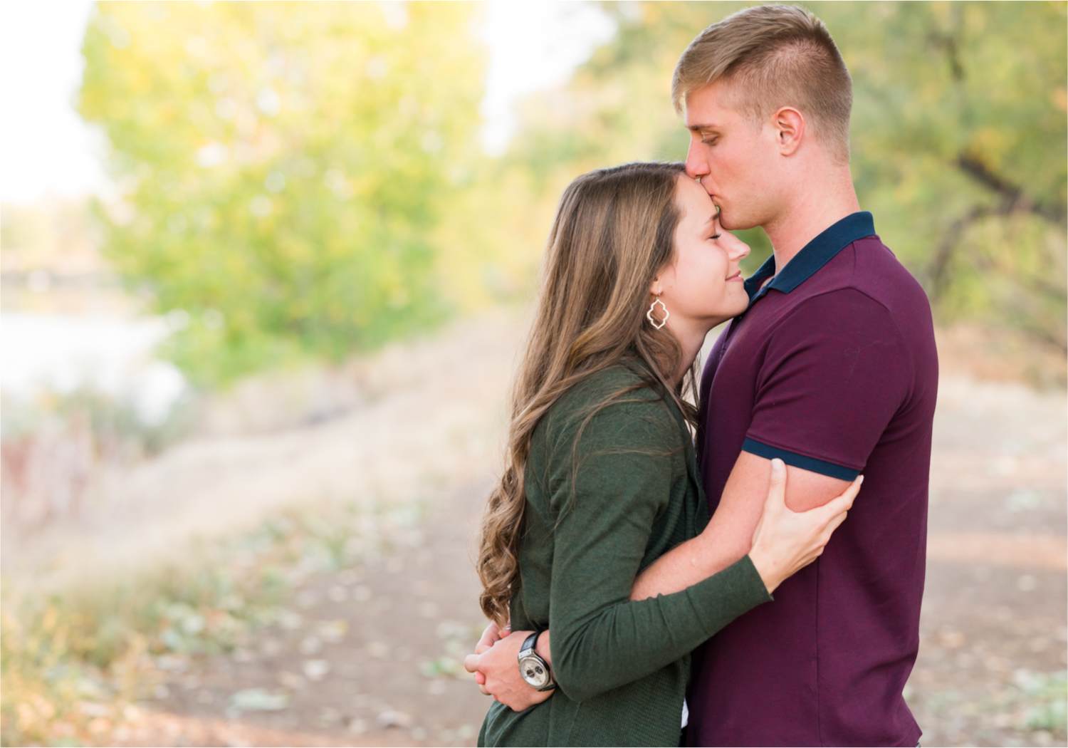 Fall Engagement at Prospect Ponds in Fort Collins | Britni Girard Photography | Colorado Wedding Photography and Videography | Husband and Wife Team | Trails of fall leaves and romantic snuggles under the canopy of color