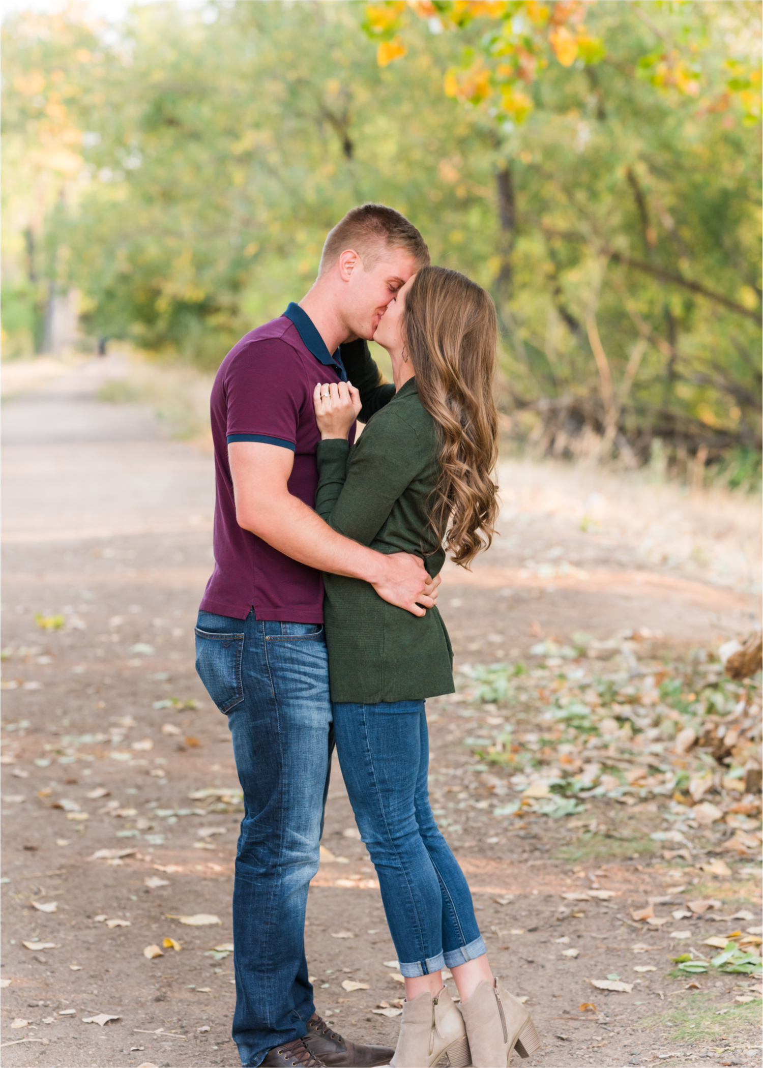 Fall Engagement at Prospect Ponds in Fort Collins | Britni Girard Photography | Colorado Wedding Photography and Videography | Husband and Wife Team | Trails of fall leaves and romantic snuggles under the canopy of color
