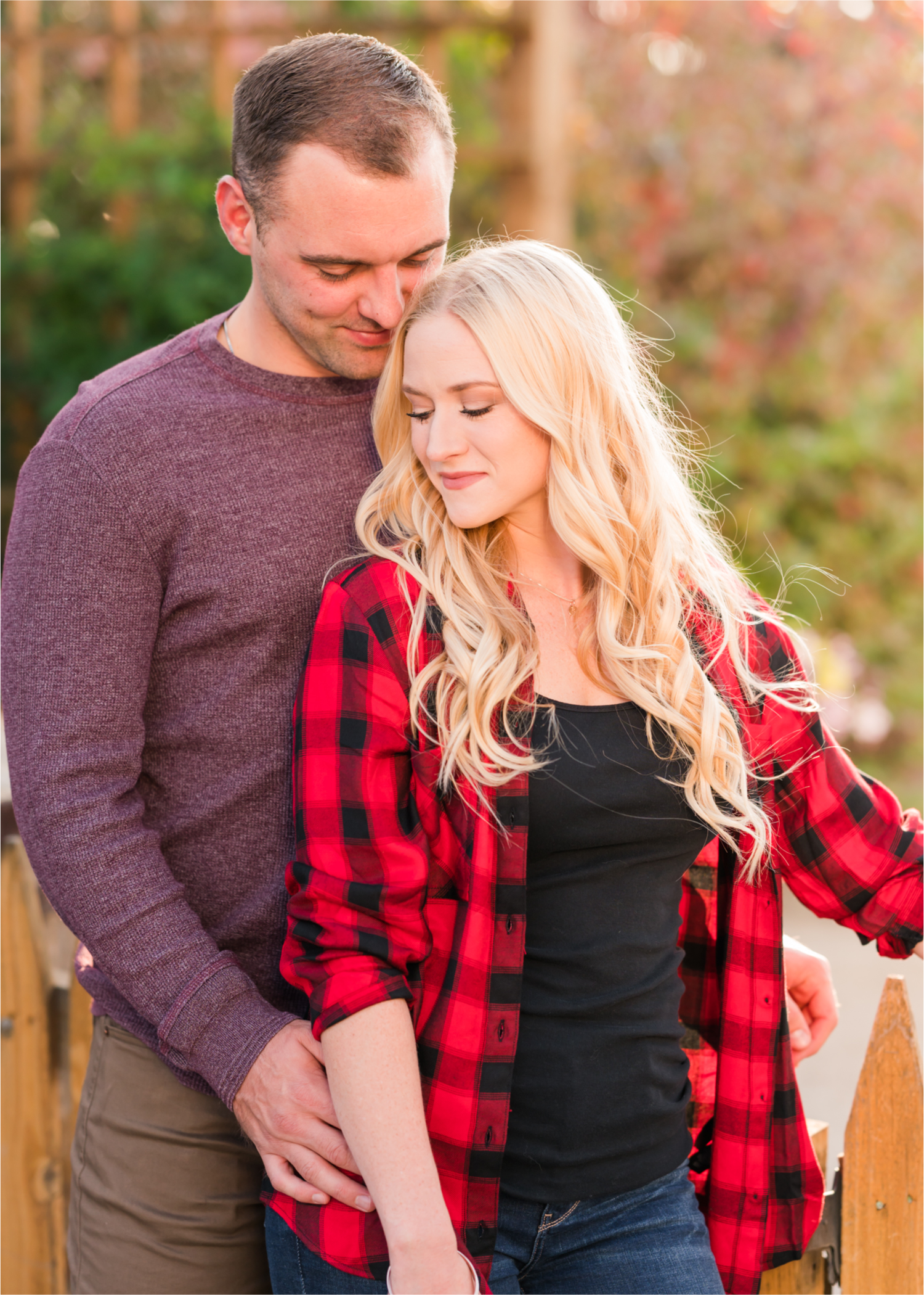 Romantic Fall Farmhouse Engagement at Jessup Farm | Britni Girard Photography | Colorado Wedding Photographer and Videography team | Rustic fences, fall leaves and barn doors in Fort Collins