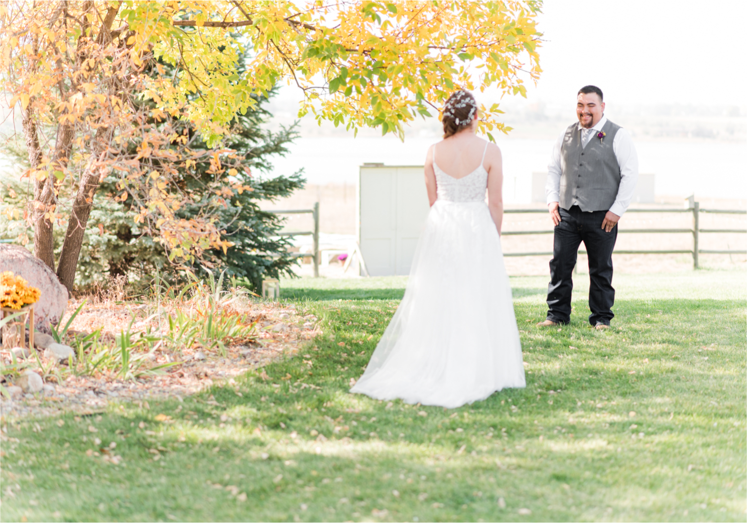 Rustic Fall Wedding at country home overlooking longs peak | Britni Girard Photography | Colorado Wedding Photography and Videography team | Fall colors, country fences leading to mountain views | Relaxed DIY wedding with elegant charm | Florals by Tahnee Wydra | Brides Dress from Abeille Bridal | Best Event Rentals