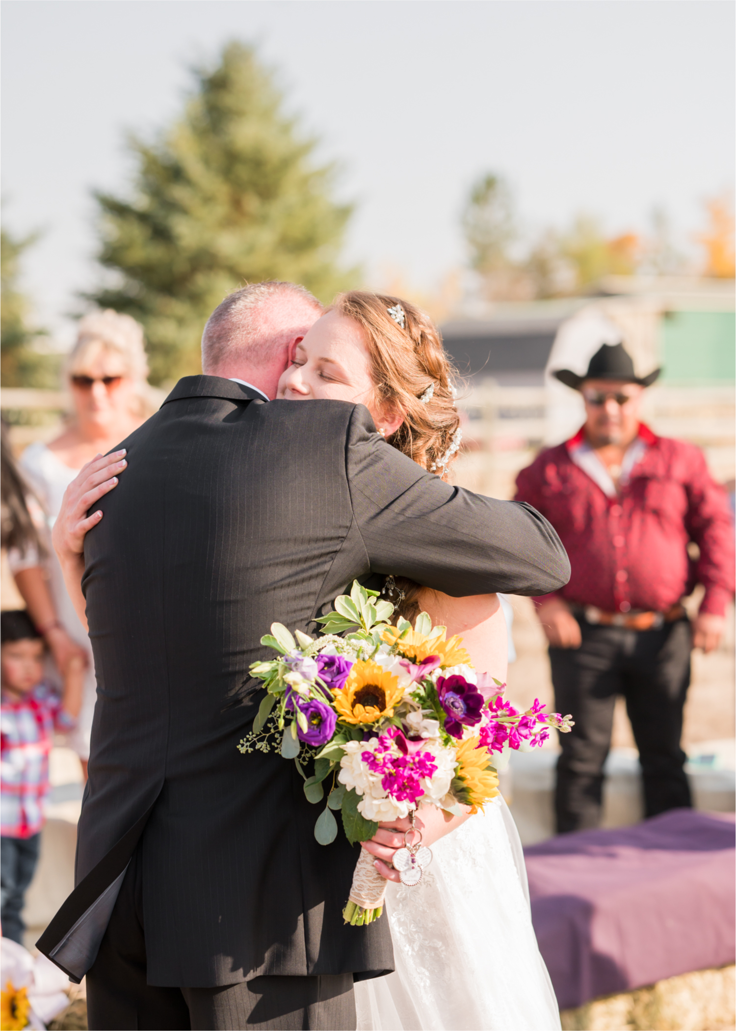 Rustic Fall Wedding at country home overlooking longs peak | Britni Girard Photography | Colorado Wedding Photography and Videography team | Fall colors, country fences leading to mountain views | Relaxed DIY wedding with elegant charm | Florals by Tahnee Wydra | Brides Dress from Abeille Bridal | Best Event Rentals