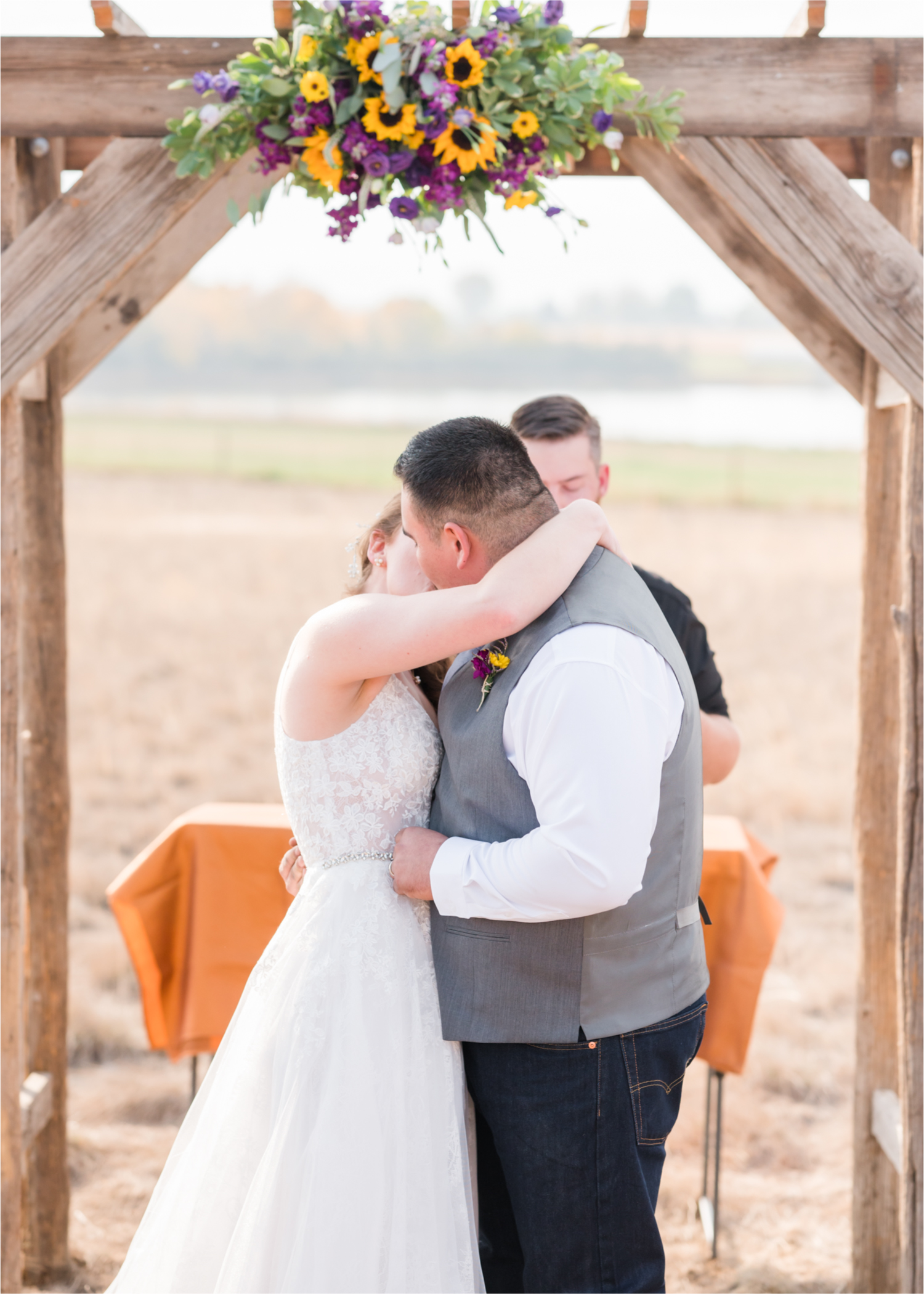 Rustic Fall Wedding at country home overlooking longs peak | Britni Girard Photography | Colorado Wedding Photography and Videography team | Fall colors, country fences leading to mountain views | Relaxed DIY wedding with elegant charm | Florals by Tahnee Wydra | Brides Dress from Abeille Bridal | Best Event Rentals