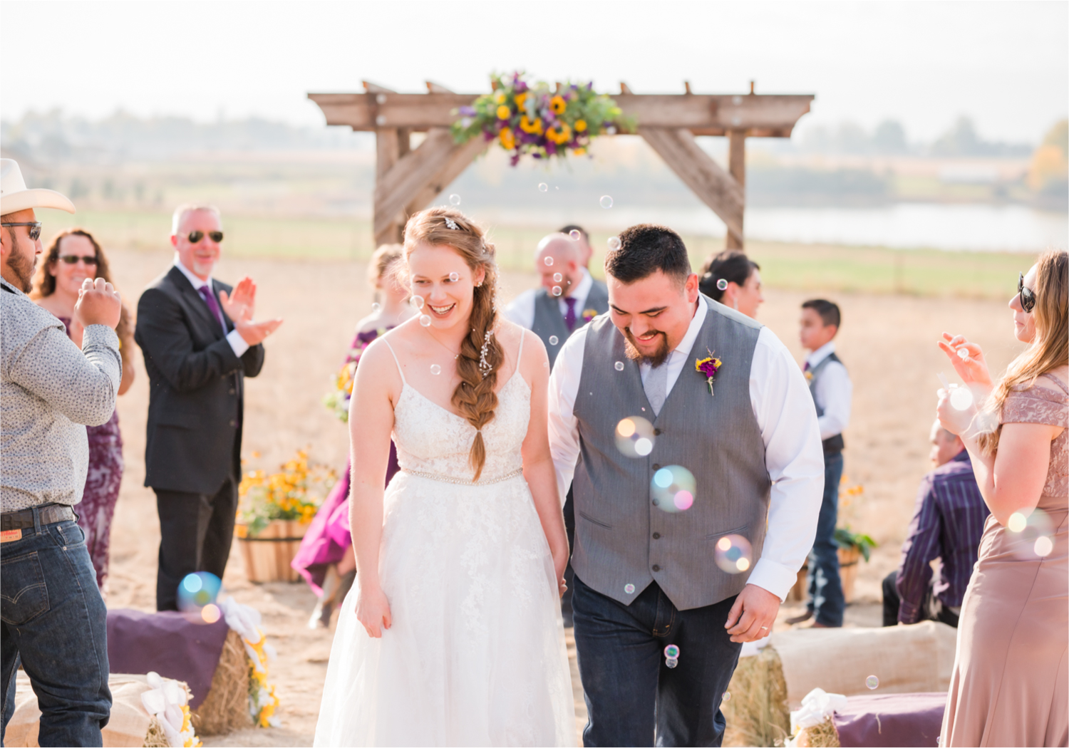 Rustic Fall Wedding at country home overlooking longs peak | Britni Girard Photography | Colorado Wedding Photography and Videography team | Fall colors, country fences leading to mountain views | Relaxed DIY wedding with elegant charm | Florals by Tahnee Wydra | Brides Dress from Abeille Bridal | Best Event Rentals | Bubble exit