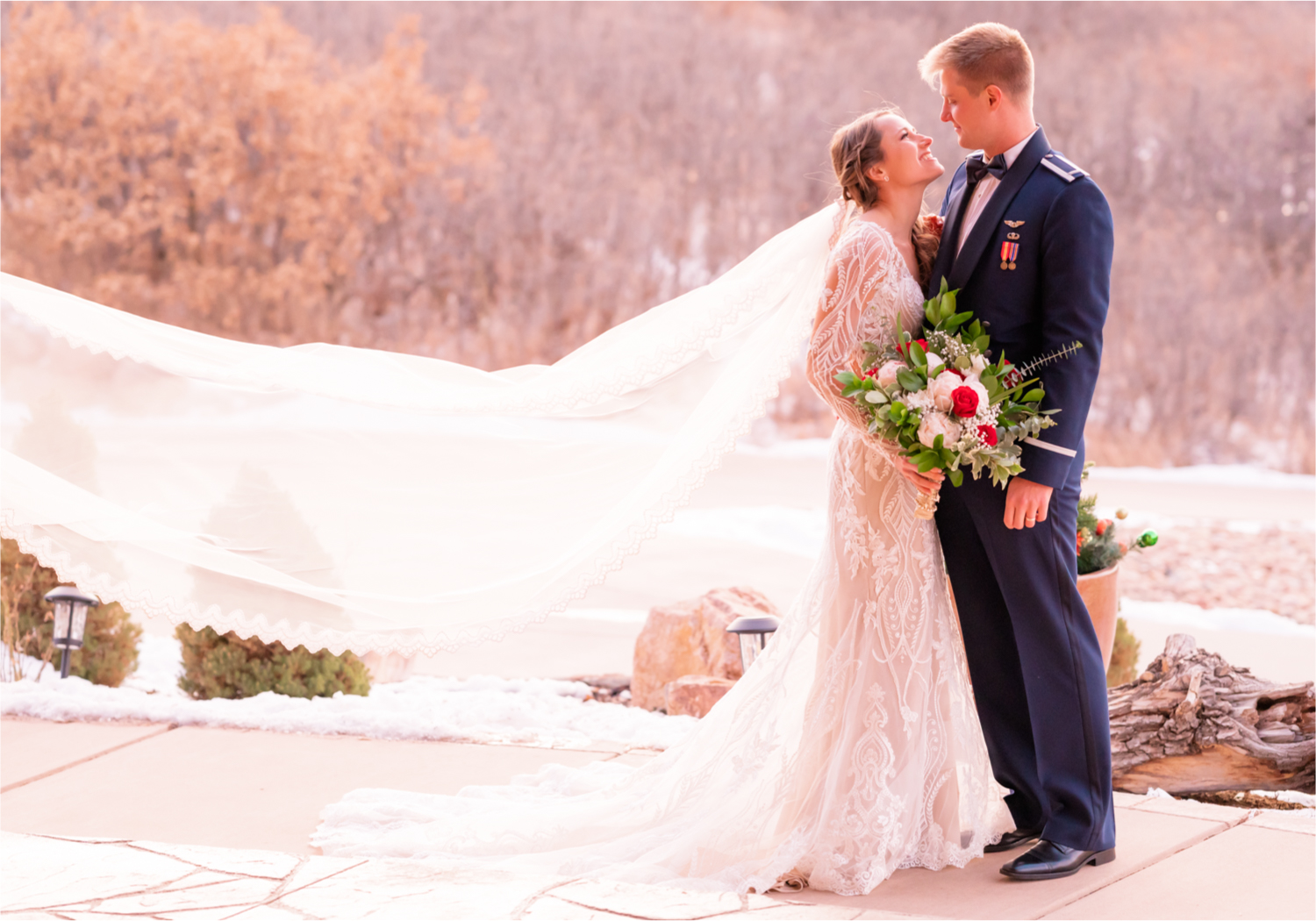 Winter Wonderland Wedding in Colorado Springs | Britni Girard Photography Colorado Wedding Photography and Film Team | Snow covered mountains and Christmas just a few days away | Annika + John's Nostalgic Winter Wedding | Bride's Dress iDream Bridal Essence of Australia | Air Force Academy | Sunset just married photos with veil flying