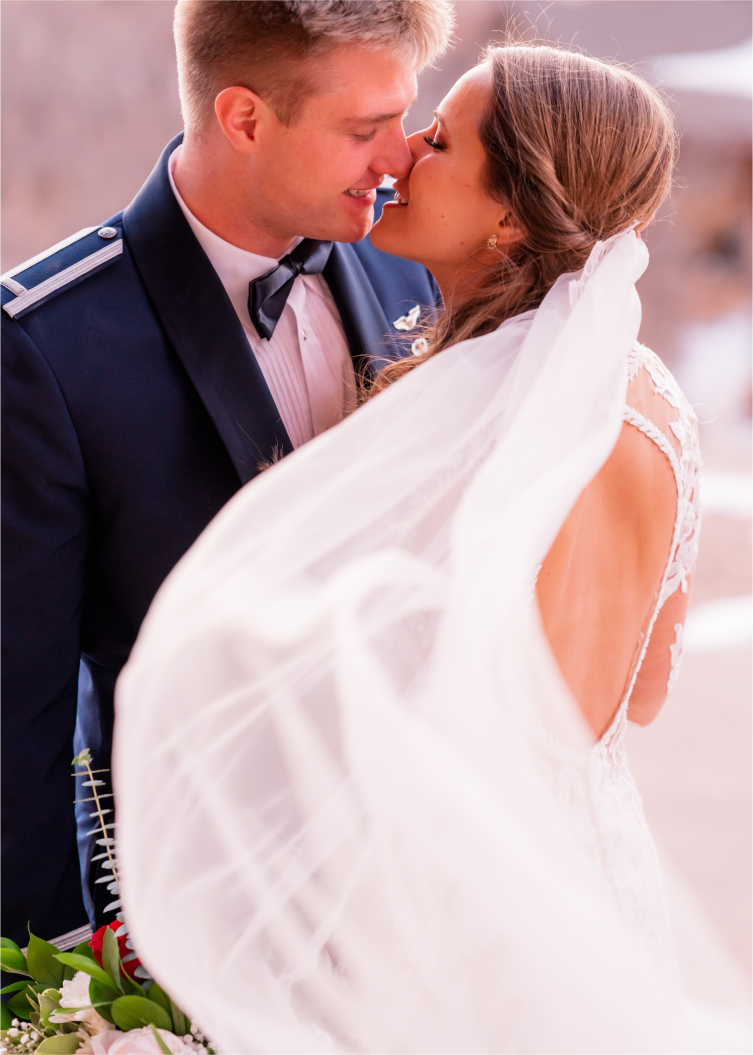 Winter Wonderland Wedding in Colorado Springs | Britni Girard Photography Colorado Wedding Photography and Film Team | Snow covered mountains and Christmas just a few days away | Annika + John's Nostalgic Winter Wedding | Bride's Dress iDream Bridal Essence of Australia | Air Force Academy | Sunset just married photos with veil flying