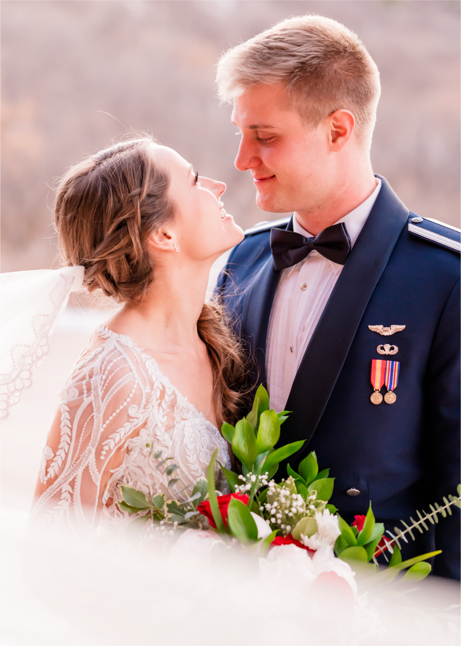 Winter Wonderland Wedding in Colorado Springs | Britni Girard Photography Colorado Wedding Photography and Film Team | Snow covered mountains and Christmas just a few days away | Annika + John's Nostalgic Winter Wedding | Bride's Dress iDream Bridal Essence of Australia | Air Force Academy | Sunset just married photos with veil flying