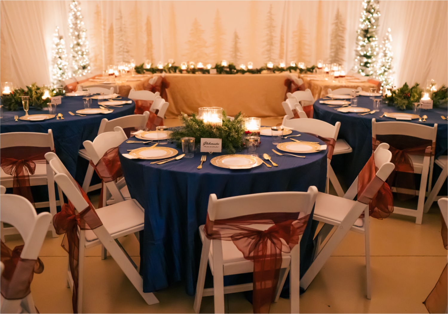 Winter Wonderland Wedding in Colorado Springs | Britni Girard Photography Colorado Wedding Photography and Film Team | Snow covered mountains and Christmas just a few days away | Annika + John's Nostalgic Winter Wedding | Bride's Dress iDream Bridal Essence of Australia | Air Force Academy | Reception with hand-painted mountain backdrops, candelight and Christmas trees.  Burgundy, Navy and Gold