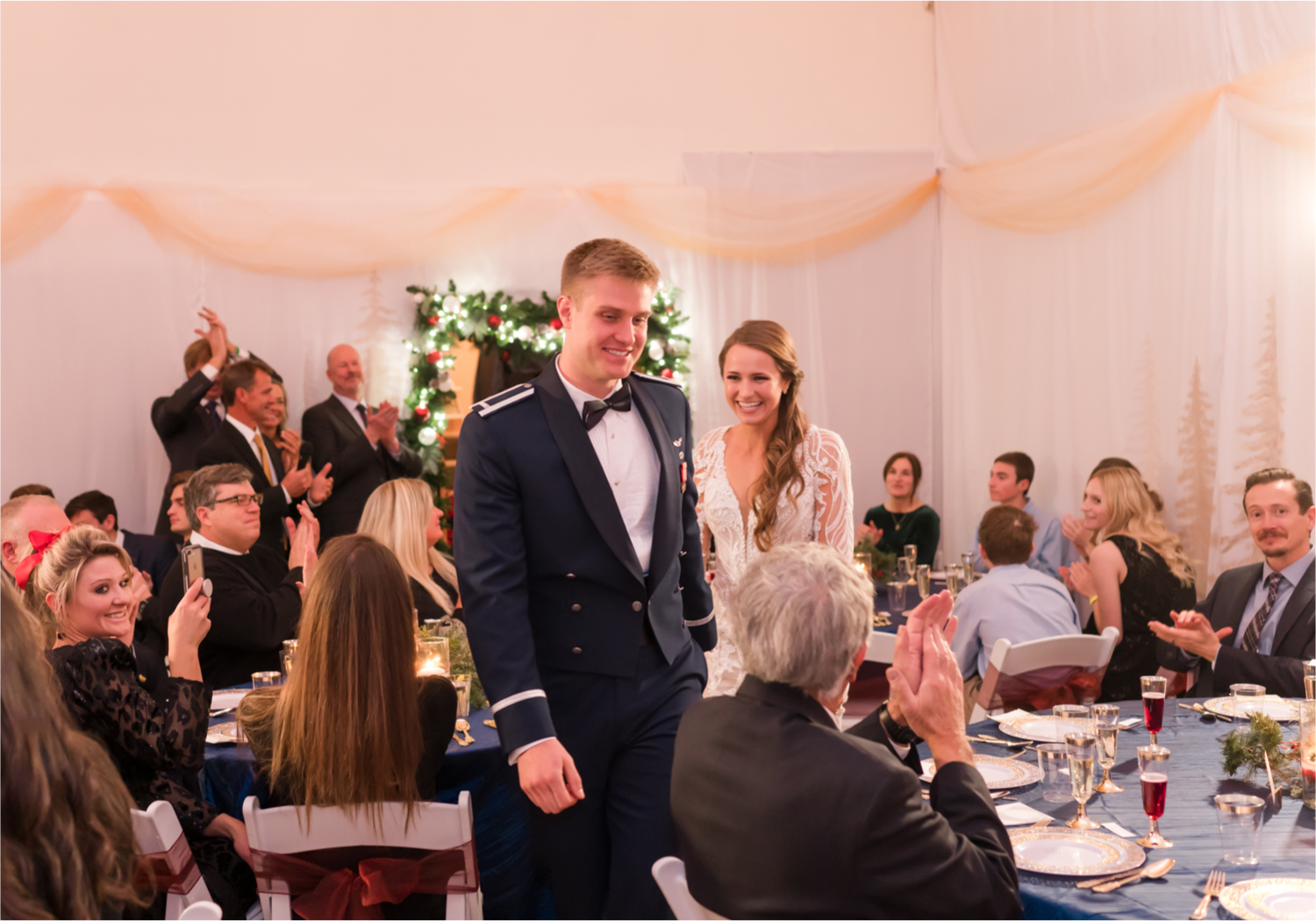 Winter Wonderland Wedding in Colorado Springs | Britni Girard Photography Colorado Wedding Photography and Film Team | Snow covered mountains and Christmas just a few days away | Annika + John's Nostalgic Winter Wedding | Bride's Dress iDream Bridal Essence of Australia | Air Force Academy | Reception with hand-painted mountain backdrops, candelight and Christmas trees.  Burgundy, Navy and Gold