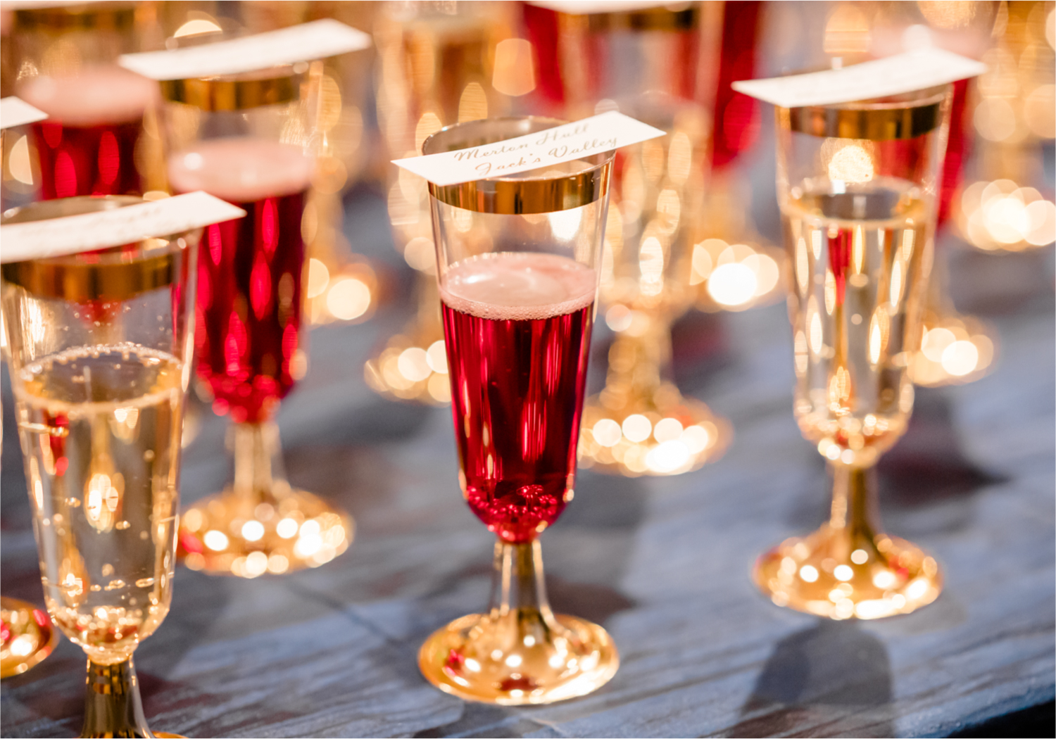 Winter Wonderland Wedding in Colorado Springs | Britni Girard Photography Colorado Wedding Photography and Film Team | Snow covered mountains and Christmas just a few days away | Annika + John's Nostalgic Winter Wedding | Bride's Dress iDream Bridal Essence of Australia | Air Force Academy | Reception with hand-painted mountain backdrops, candelight and Christmas trees.  Burgundy, Navy and Gold | Champagne flute table cards
