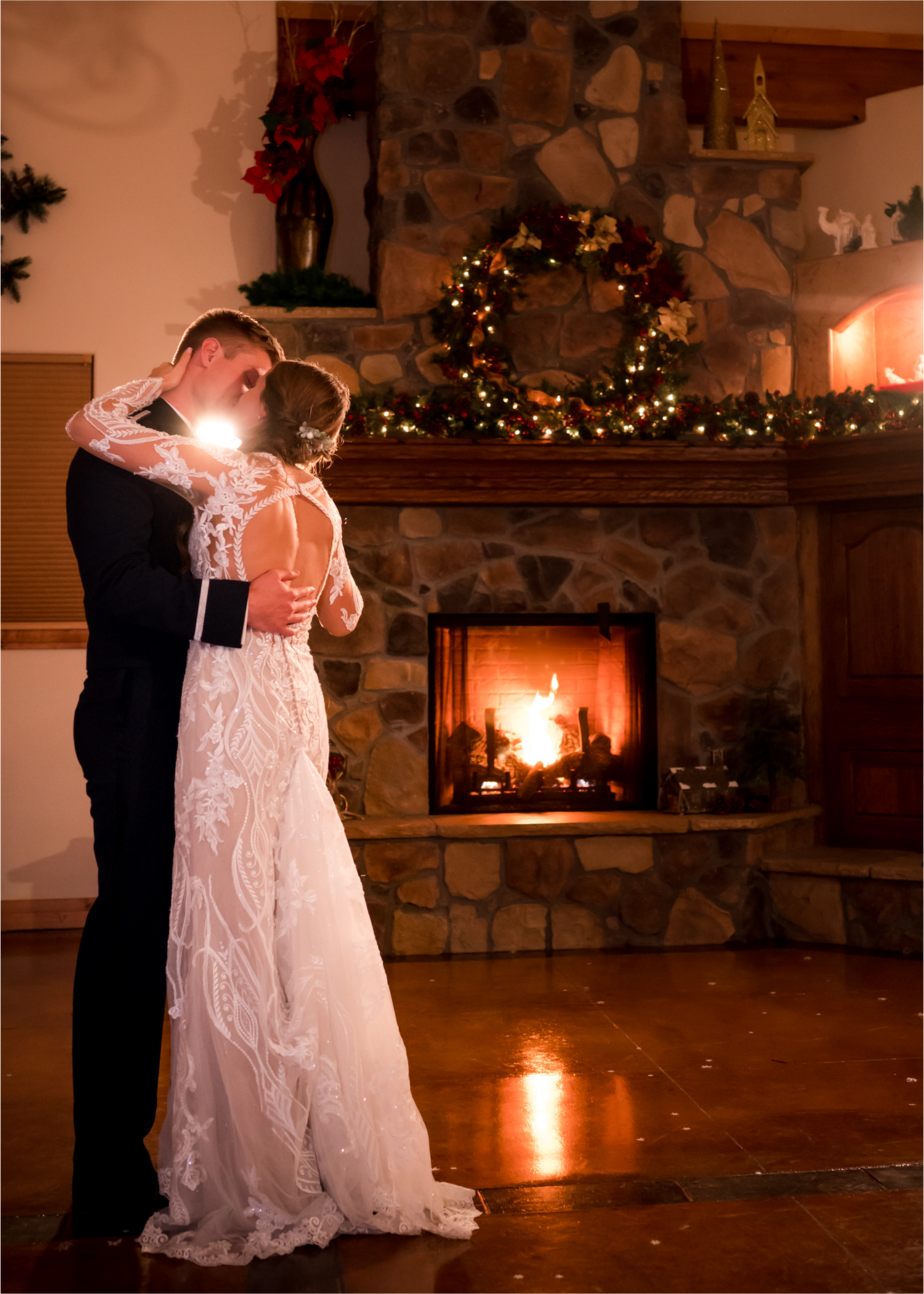 Winter Wonderland Wedding in Colorado Springs | Britni Girard Photography Colorado Wedding Photography and Film Team | Snow covered mountains and Christmas just a few days away | Annika + John's Nostalgic Winter Wedding | Bride's Dress iDream Bridal Essence of Australia | Air Force Academy | Rustic Winter Reception Bride and Groom Last Dance by Fireplace