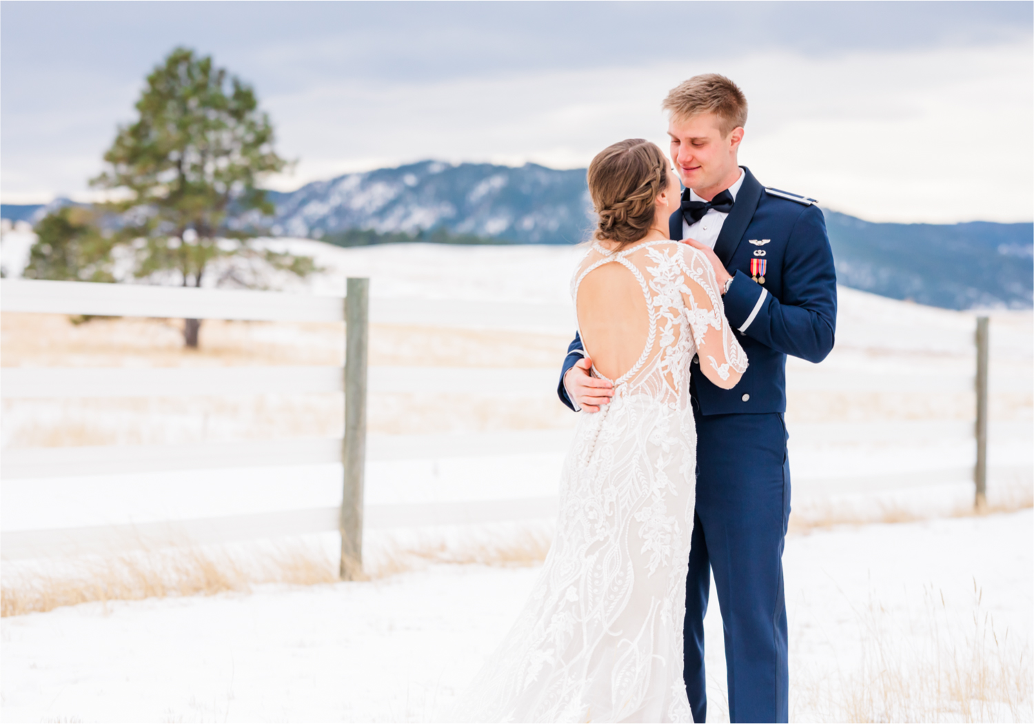 Winter Wonderland Wedding in Colorado Springs | Britni Girard Photography Colorado Wedding Photography and Film Team | Snow covered mountains and Christmas just a few days away | Annika + John's Nostalgic Winter Wedding | Bride's Dress iDream Bridal Essence of Australia | Air Force Academy | First Look in Snow and Bride and Groom Letters back to back