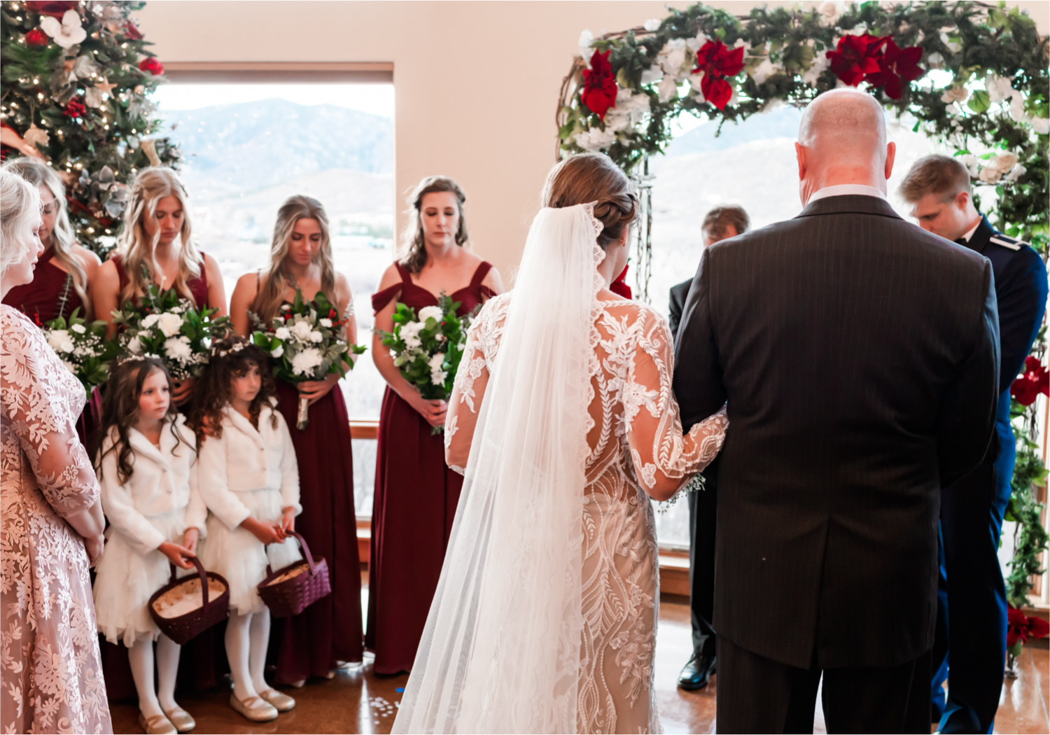 Winter Wonderland Wedding in Colorado Springs | Britni Girard Photography Colorado Wedding Photography and Film Team | Snow covered mountains and Christmas just a few days away | Annika + John's Nostalgic Winter Wedding | Bride's Dress iDream Bridal Essence of Australia | Air Force Academy | Ceremony Entrance Rustic Cabin 