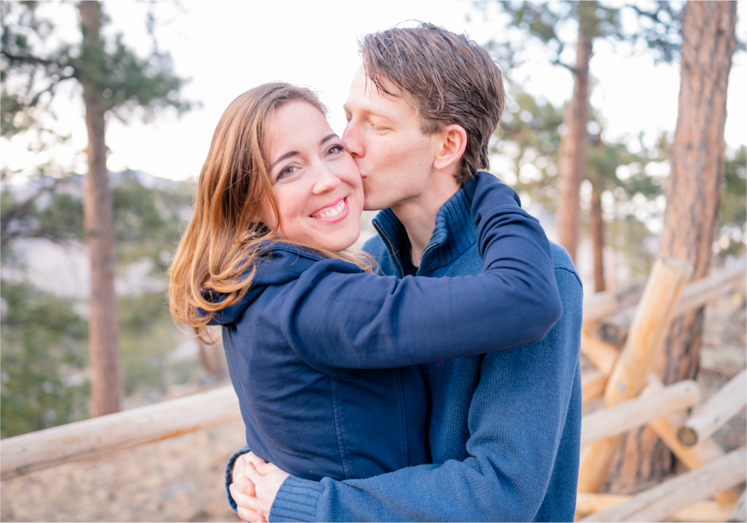 Winter Engagement on Lookout Mountain in Golden Colorado | Britni Girard Photography | Destination Photo and Video Team | Epic views of Golden, dreamy sunsets, dancing and snuggles.  A sweet couple shares time of prayer together during their romantic engagement session.