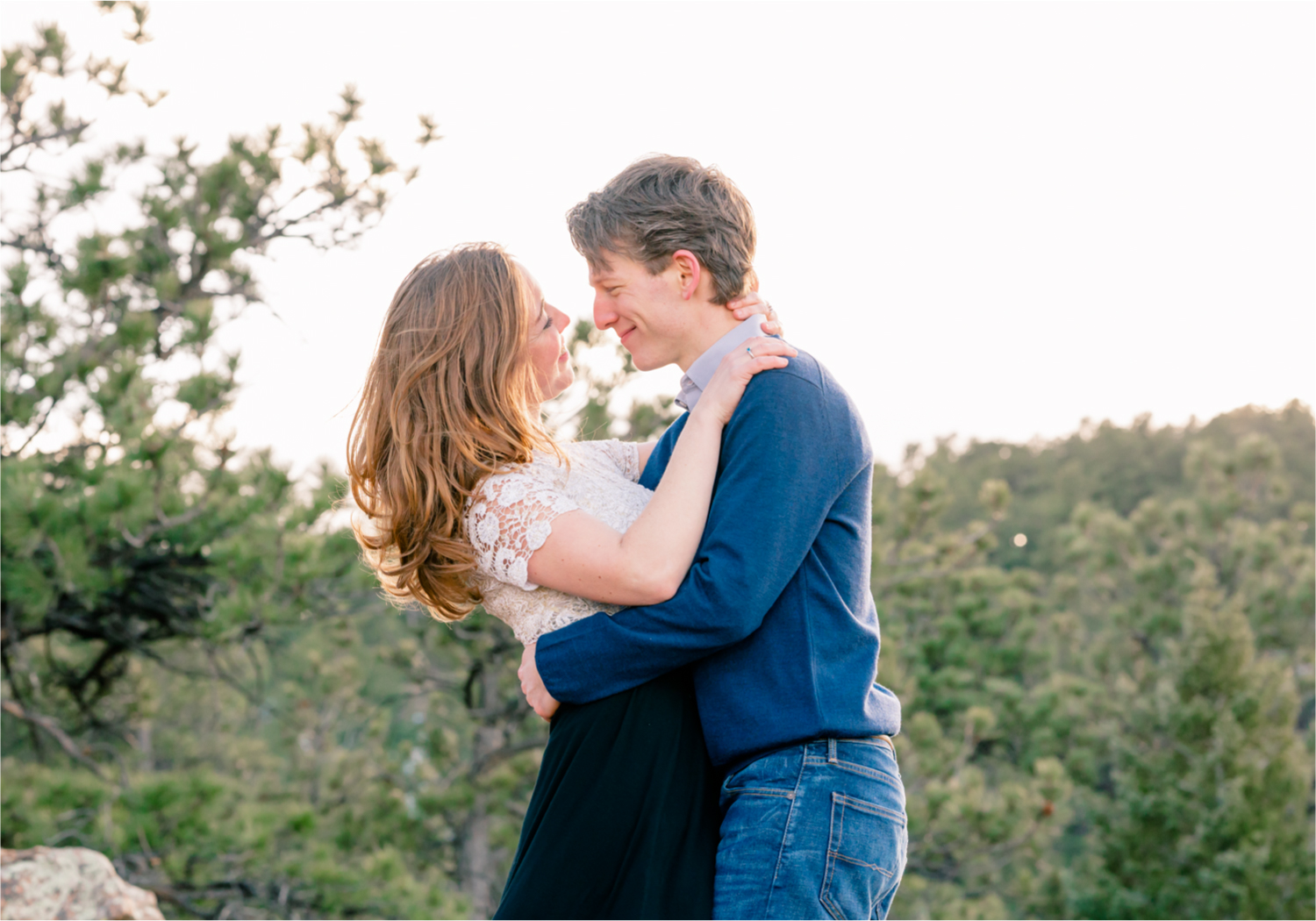 Winter Engagement on Lookout Mountain in Golden Colorado | Britni Girard Photography | Destination Photo and Video Team | Epic views of Golden, dreamy sunsets, dancing and snuggles.  A sweet couple shares time of prayer together during their romantic engagement session.