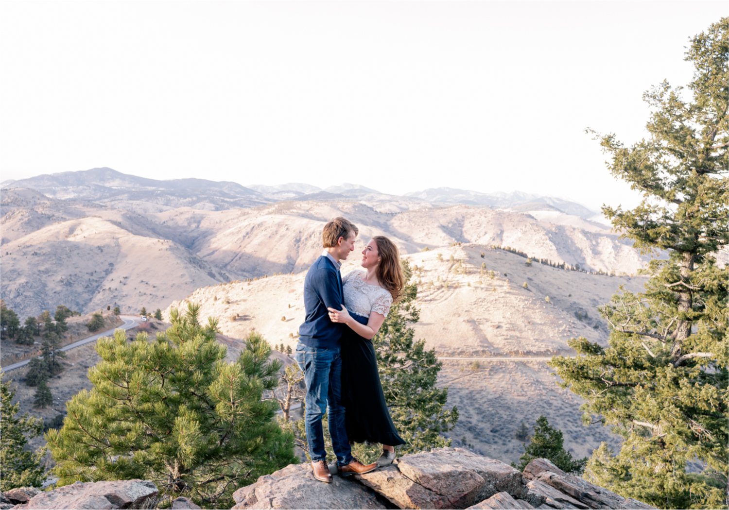 Winter Engagement on Lookout Mountain in Golden Colorado | Britni Girard Photography | Destination Photo and Video Team | Epic views of Golden, dreamy sunsets, dancing and snuggles.  A sweet couple shares time of prayer together during their romantic engagement session.